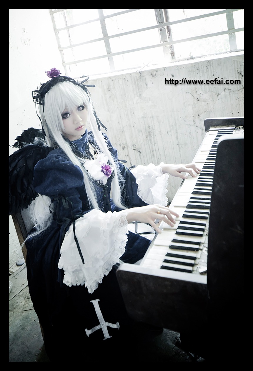 1girl black_dress black_wings dress electric_guitar feathers flower frills guitar instrument letterboxed long_hair music piano pillarboxed playing_instrument plectrum silver_hair sitting solo suigintou wings