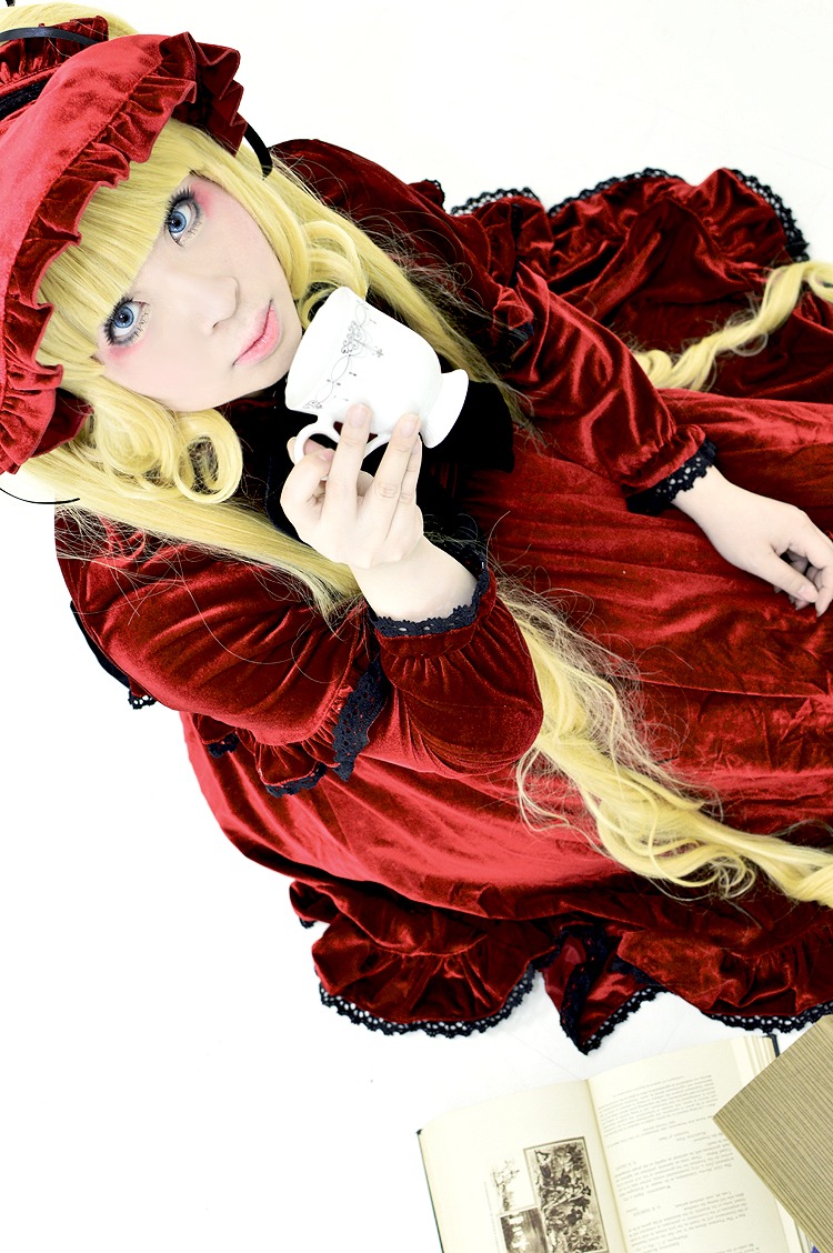 1girl bangs blonde_hair blue_eyes bonnet cup dress eyelashes frills hat holding holding_cup lace lolita_fashion long_hair long_sleeves looking_at_viewer red_dress shinku sitting solo teacup very_long_hair