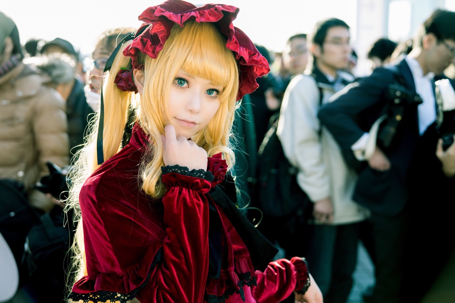 1girl blonde_hair blurry blurry_background blurry_foreground bonnet depth_of_field flower long_hair long_sleeves looking_at_viewer multiple_boys shinku solo solo_focus