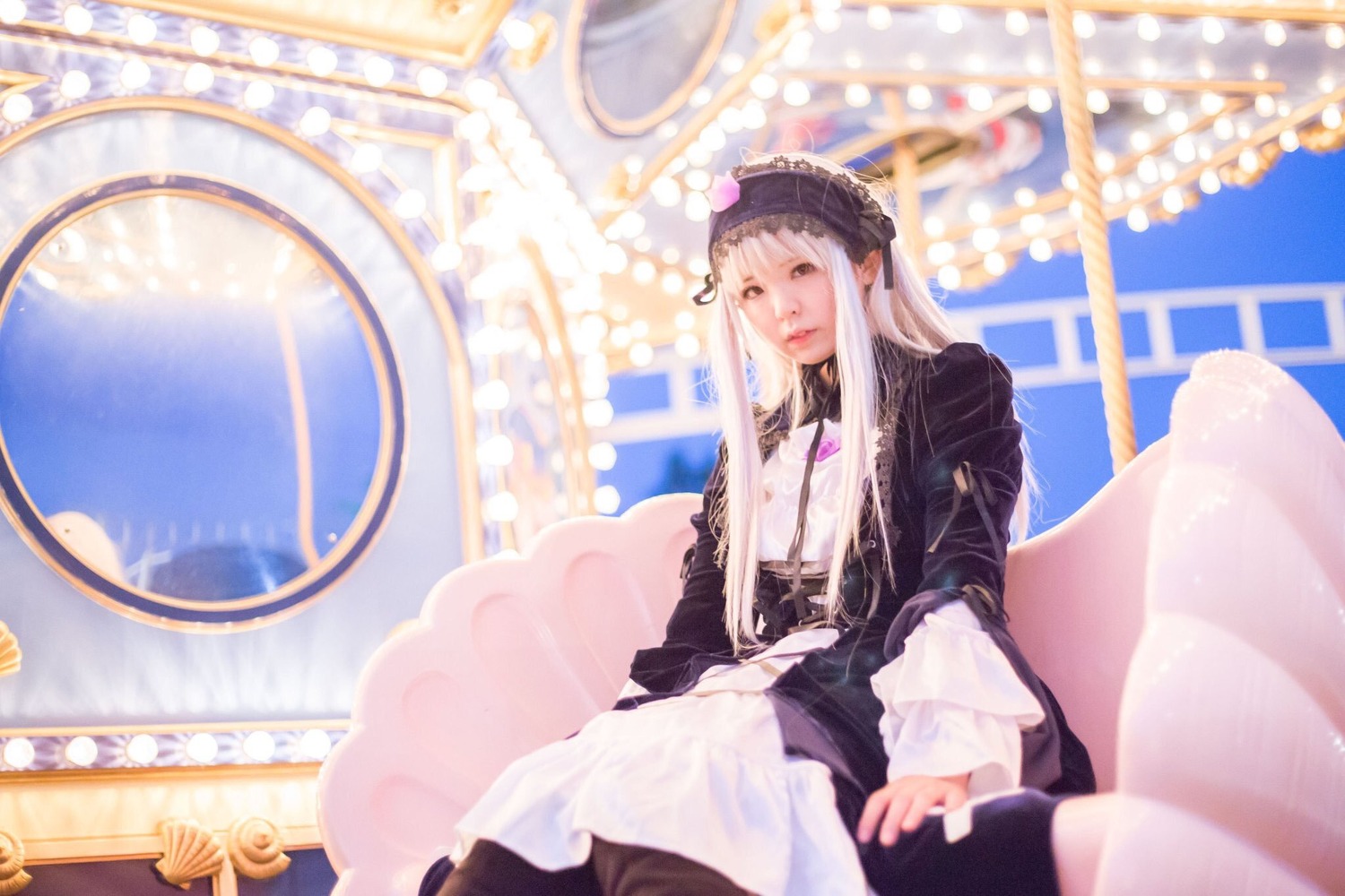 1girl birdcage black_dress blurry blurry_background blurry_foreground depth_of_field dress ferris_wheel frills indoors long_hair long_sleeves sitting solo suigintou very_long_hair white_hair