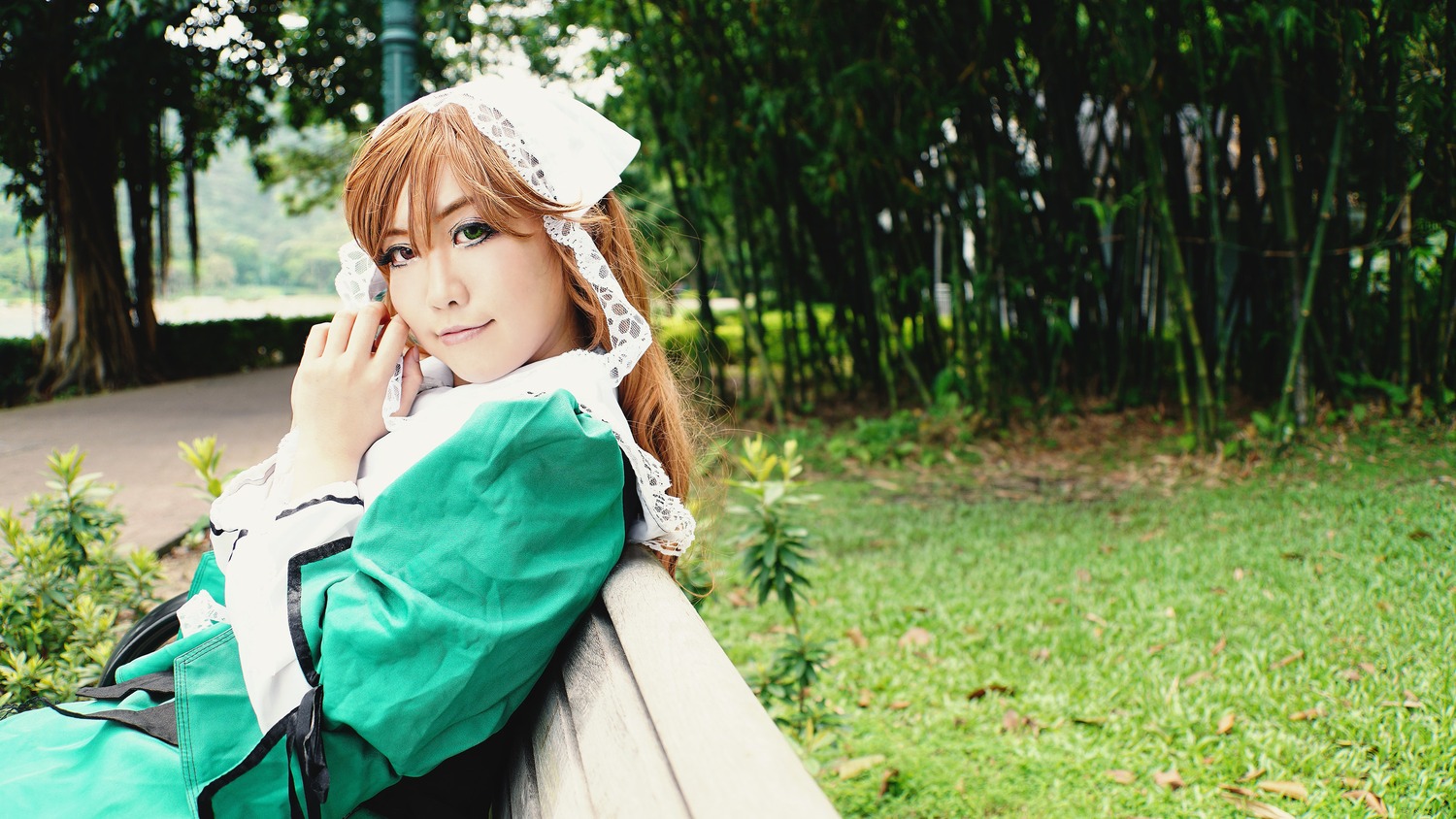 1girl apron brown_hair day green_eyes lips long_hair long_sleeves looking_at_viewer nature outdoors plant smile solo suiseiseki tree