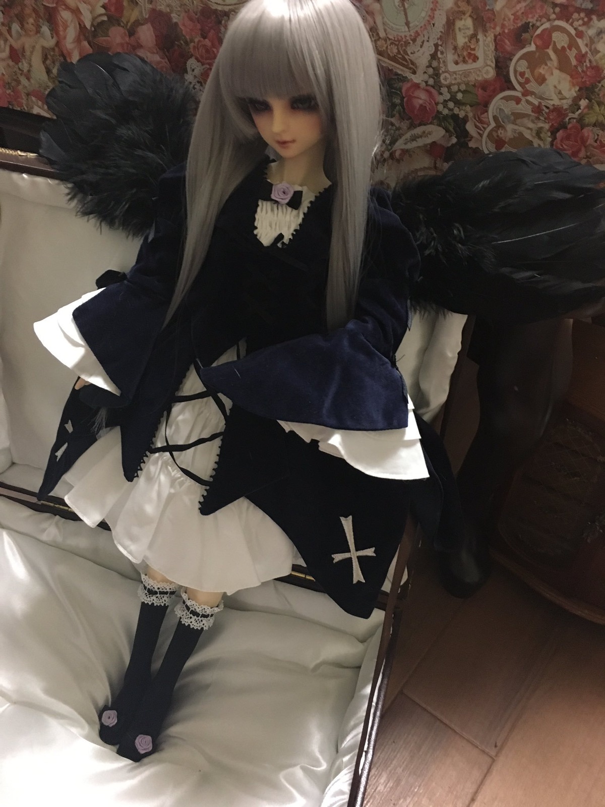 1girl bangs black_wings blunt_bangs doll dress flower long_hair rose sitting solo suigintou white_hair wings