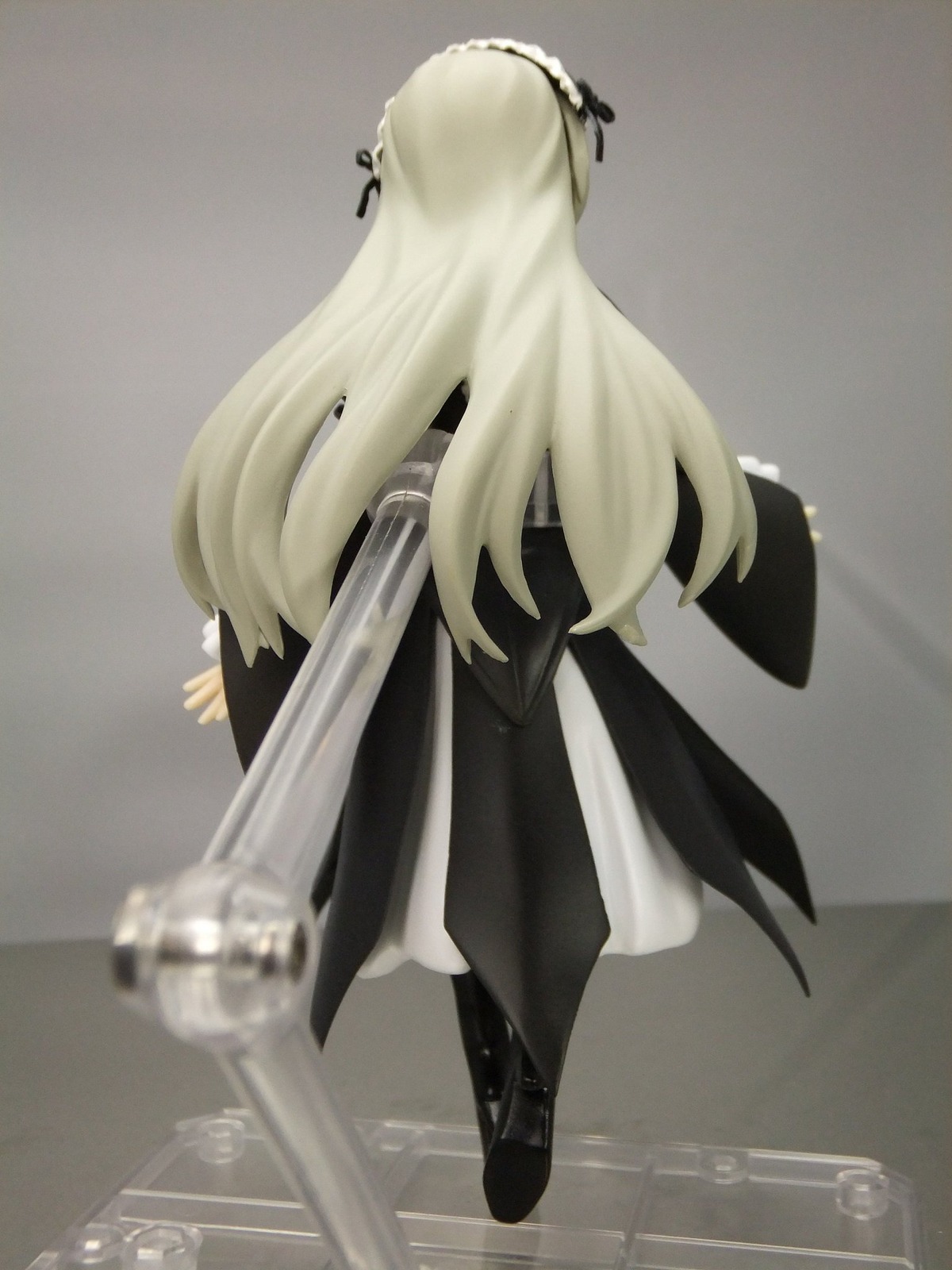 1girl black_footwear blonde_hair boots doll dress full_body hair_ribbon long_hair long_sleeves ribbon solo standing suigintou very_long_hair weapon