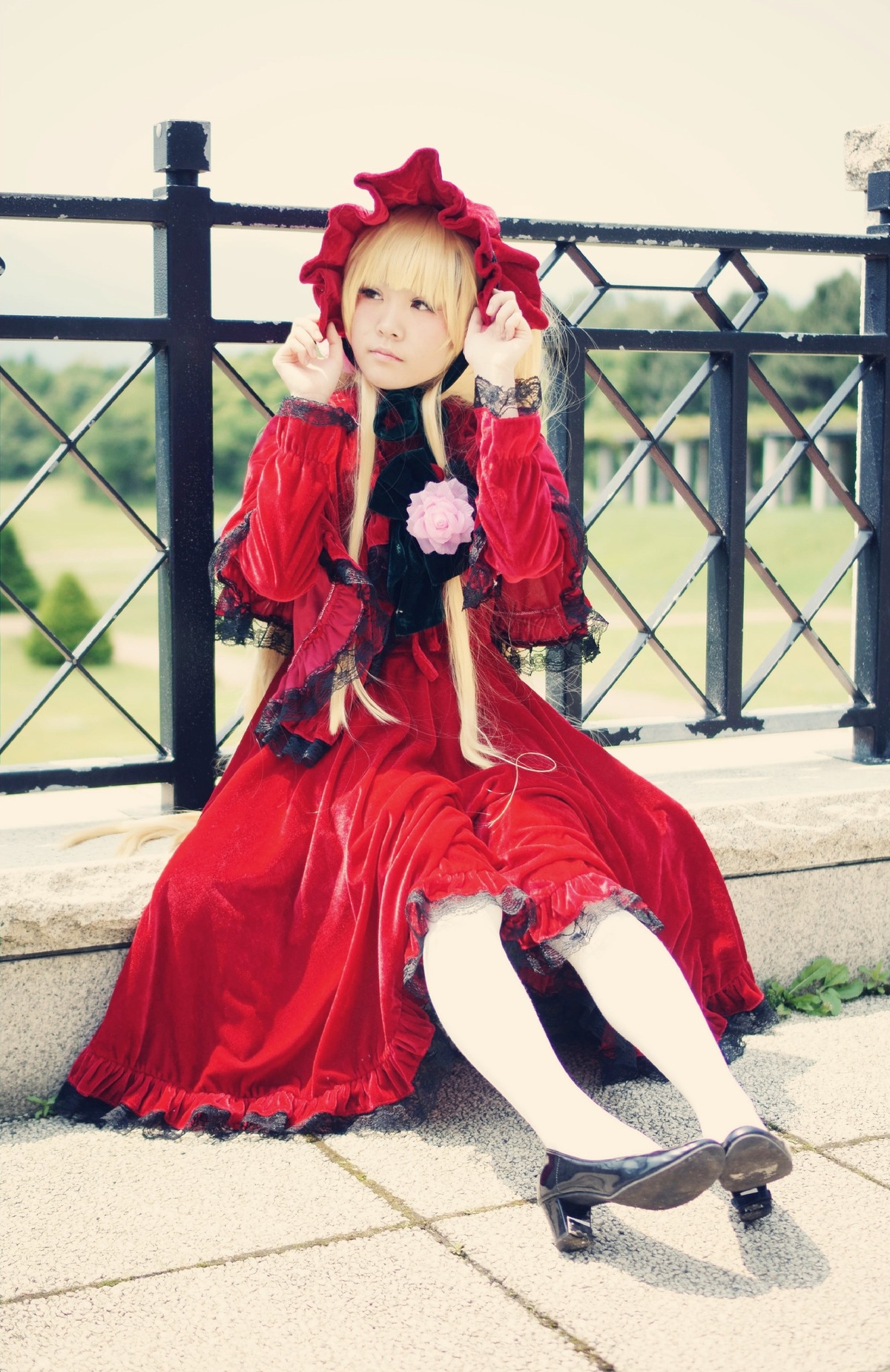 1girl blonde_hair bonnet bow dress flower frills long_hair red_dress rose shinku shoes sitting solo tiles window