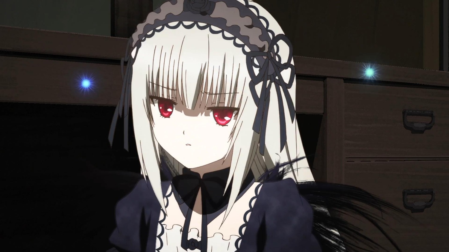 1girl bangs black_ribbon closed_mouth detached_collar dress eyebrows_visible_through_hair hairband image indoors long_hair looking_at_viewer red_eyes ribbon silver_hair solo suigintou