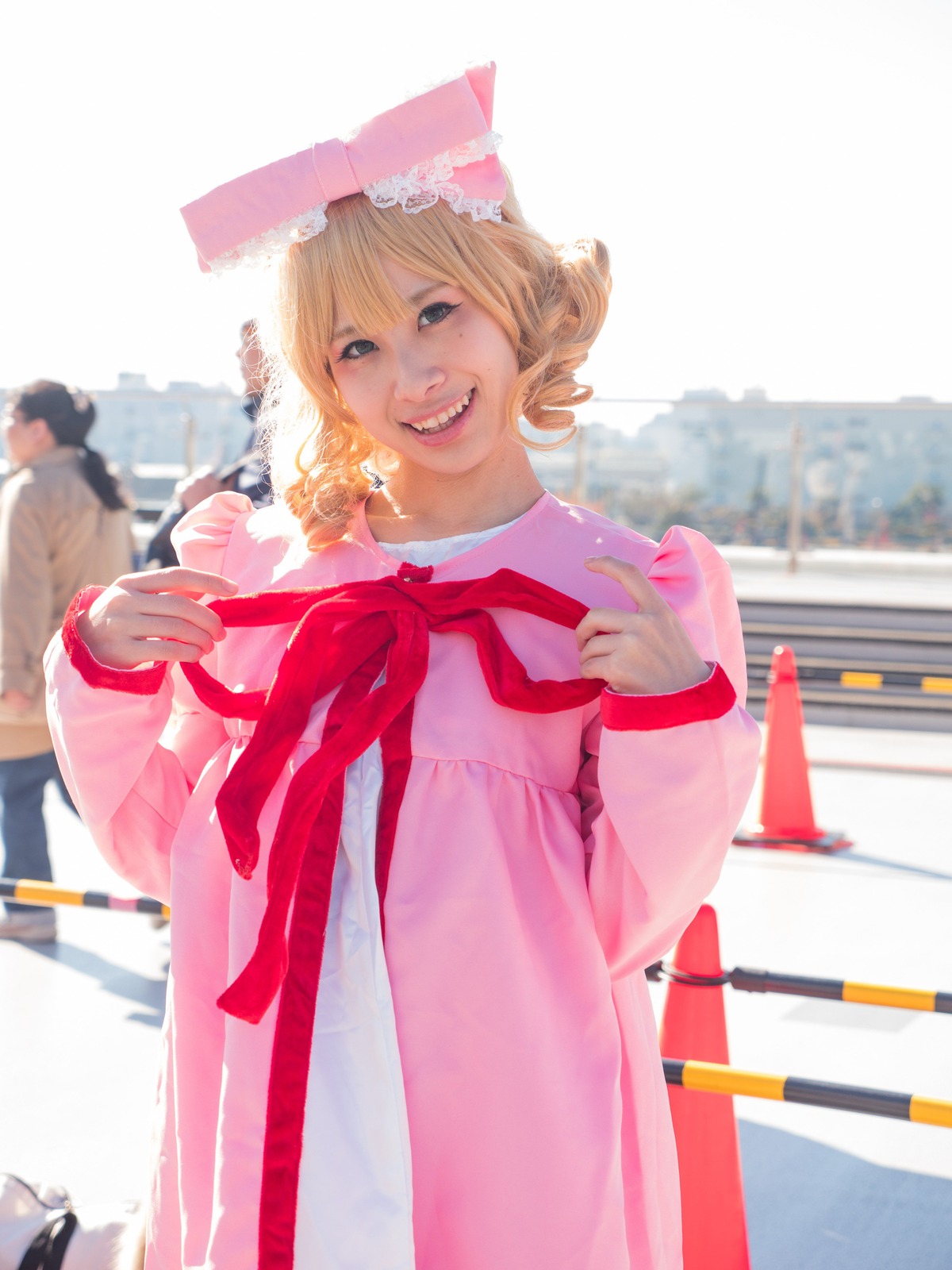 1girl 3d blonde_hair dress drill_hair hat hinaichigo outdoors railing realistic ribbon smile solo teeth umbrella