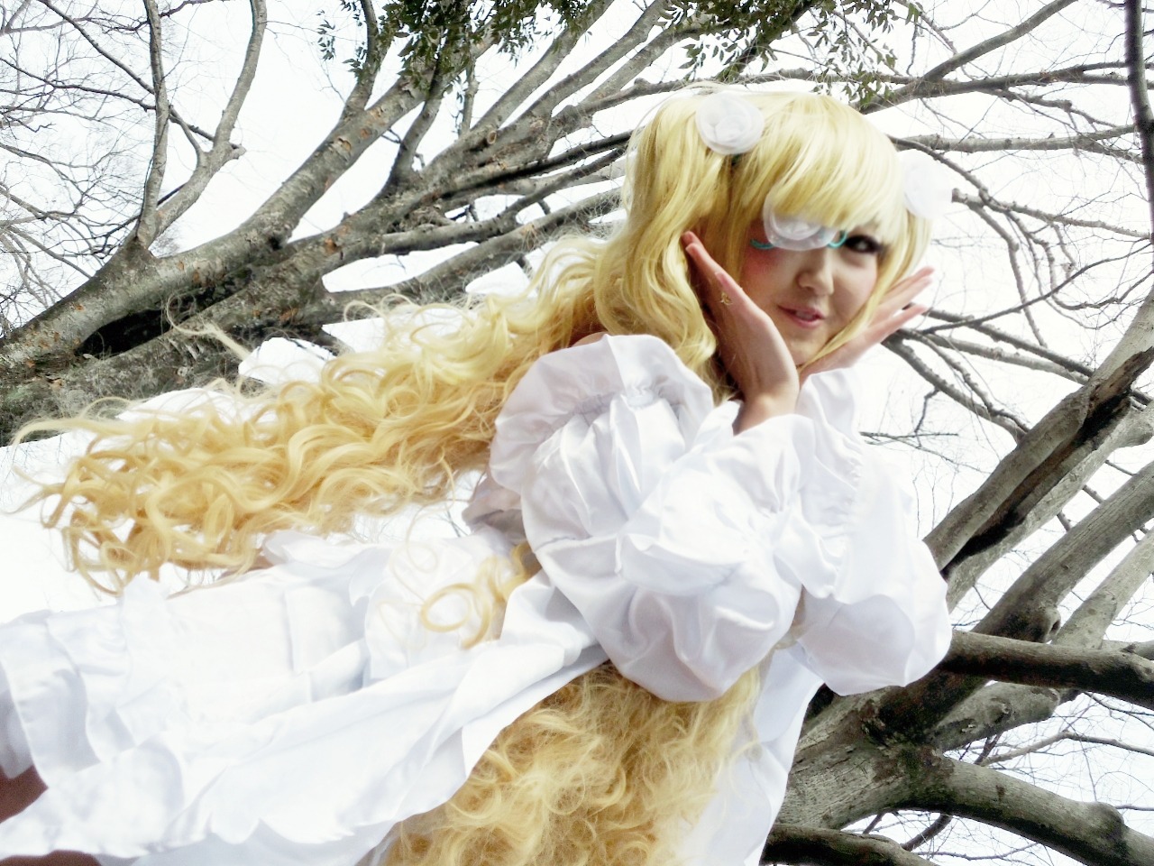 1girl bare_tree blonde_hair blue_eyes branch breasts day dress eyepatch forest kirakishou lips long_hair looking_at_viewer nature outdoors solo tree wavy_hair white_dress