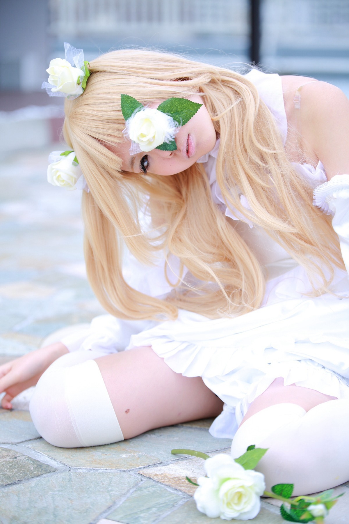 1girl blonde_hair blurry depth_of_field dress eyepatch flower hair_flower hair_ornament kirakishou lips long_hair rose sitting solo white_dress white_flower white_rose