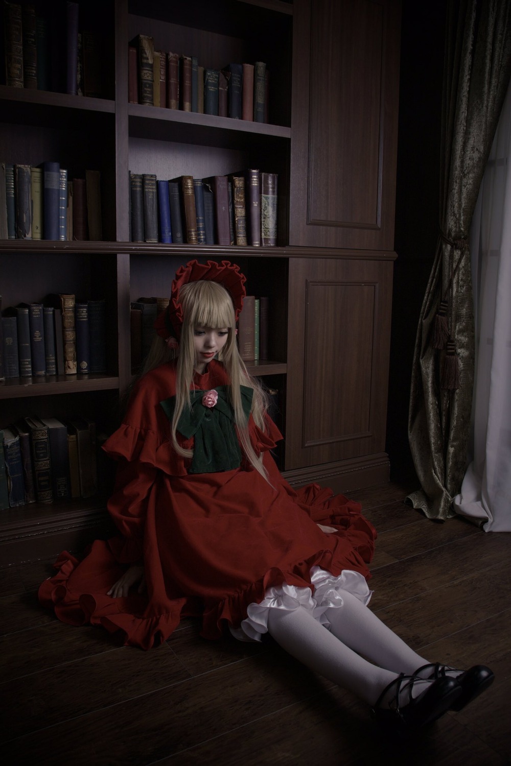 1girl bangs blonde_hair bonnet book book_stack bookshelf curtains dress indoors lolita_fashion long_hair open_book pantyhose red_dress shinku shoes sitting solo white_legwear