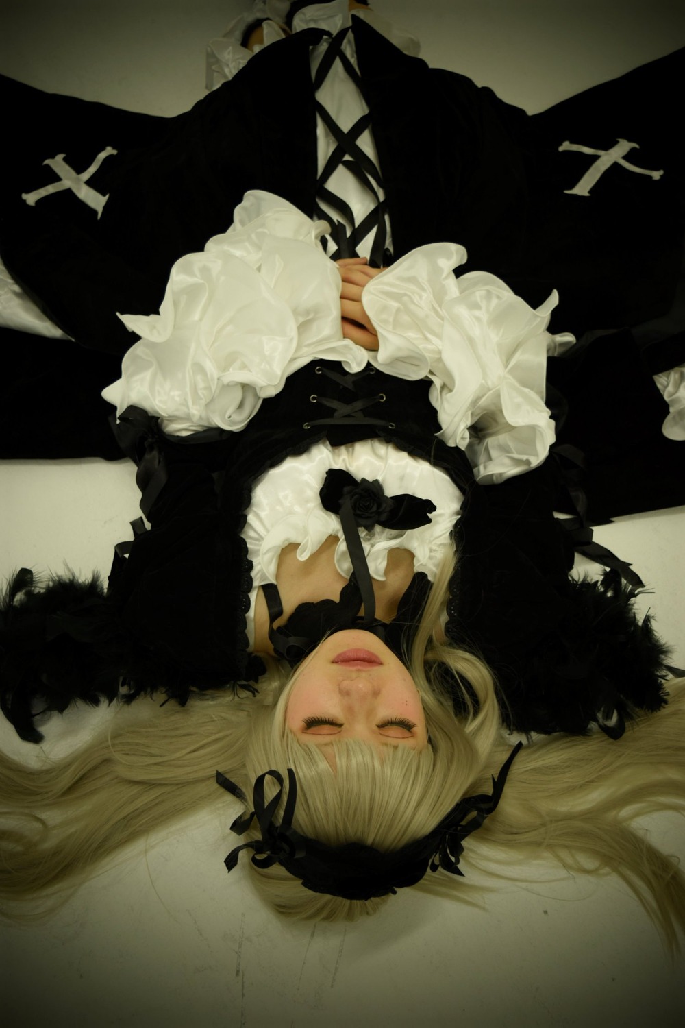 1girl black_dress blonde_hair closed_eyes cross dress flower gothic_lolita lace lips lolita_fashion long_hair long_sleeves ribbon rose solo suigintou