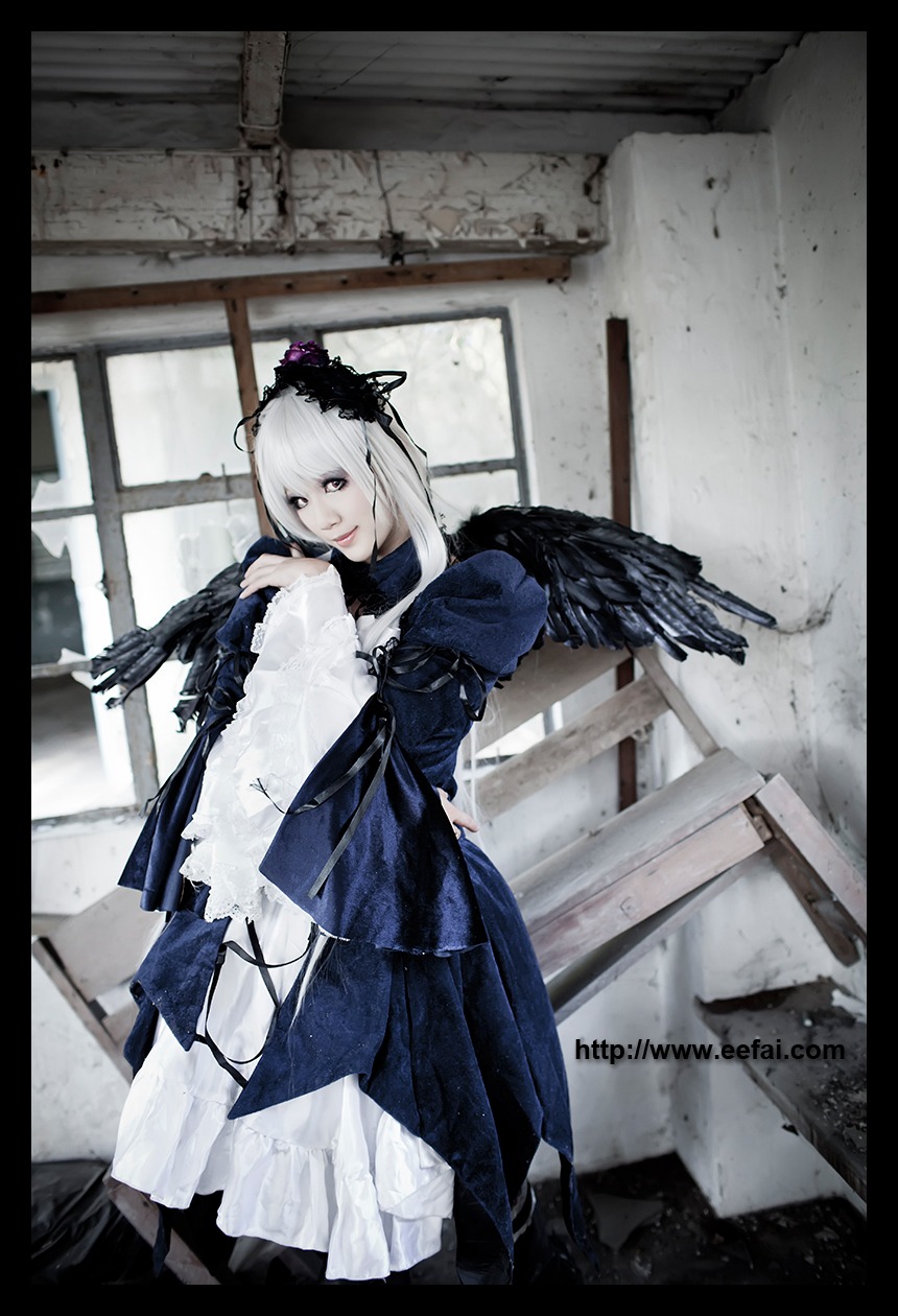 1girl bird black_border black_feathers black_wings crow dress feathered_wings feathers letterboxed looking_at_viewer pillarboxed solo standing suigintou white_hair wings