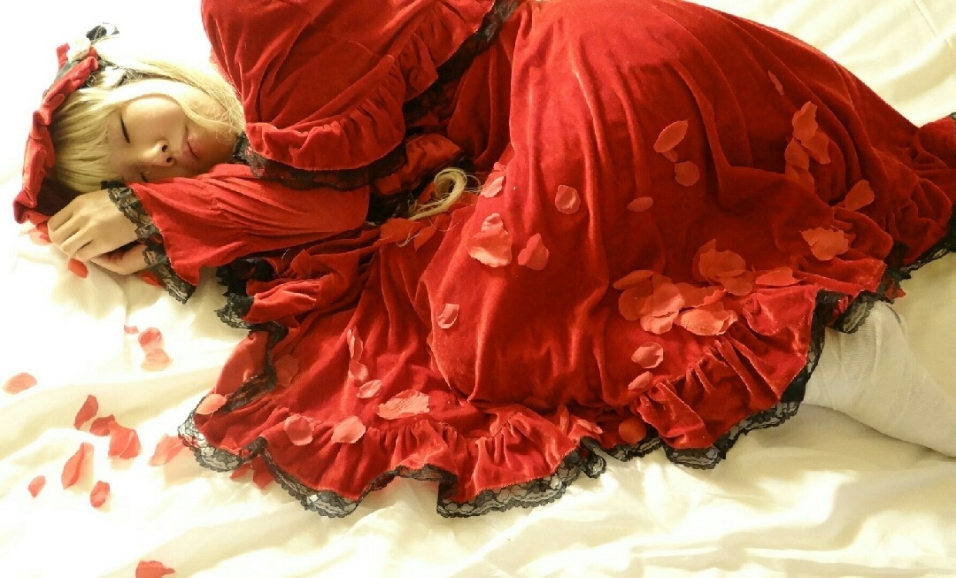 1girl blonde_hair closed_eyes dress frills long_sleeves lying on_back on_side petals red_dress shinku sleeping solo