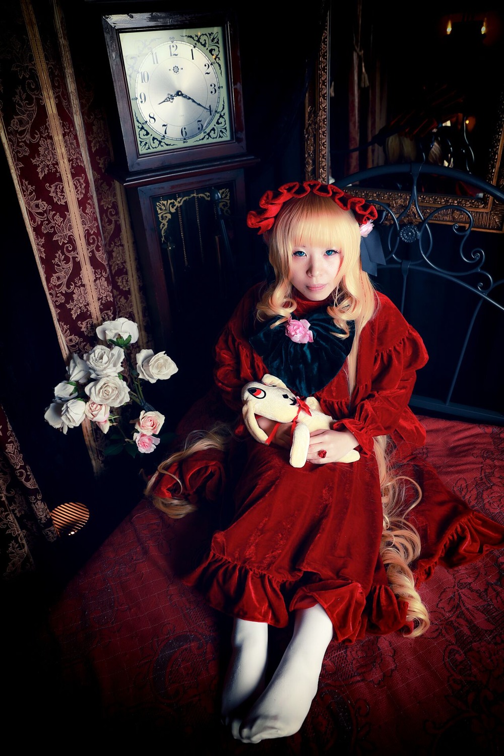 1girl blonde_hair blue_eyes dress drill_hair flower long_hair red_dress rose shinku sitting solo stuffed_animal very_long_hair