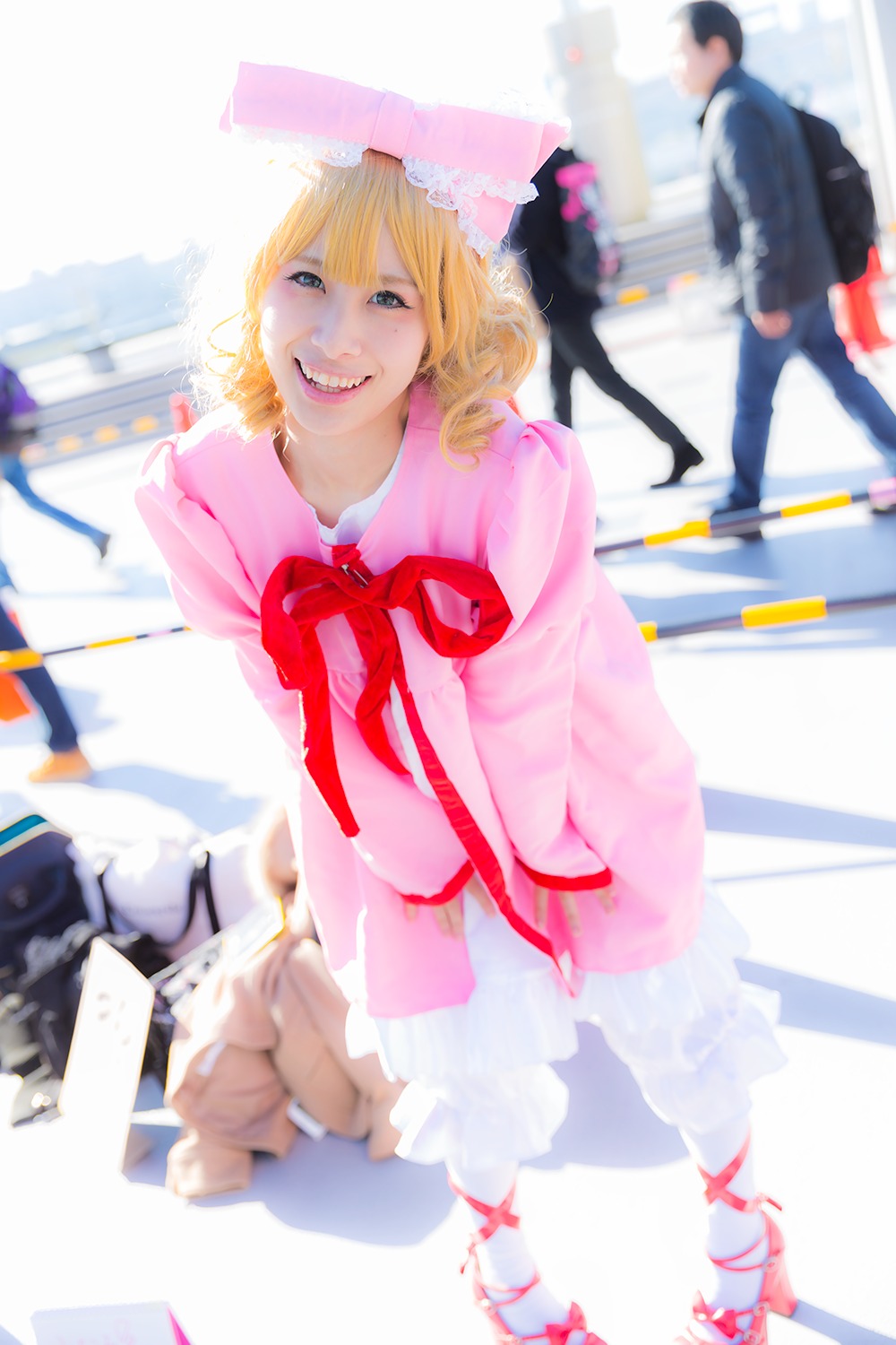 blonde_hair blue_eyes blurry blurry_background blurry_foreground depth_of_field dress hat hinaichigo looking_at_viewer ribbon smile solo solo_focus striped umbrella