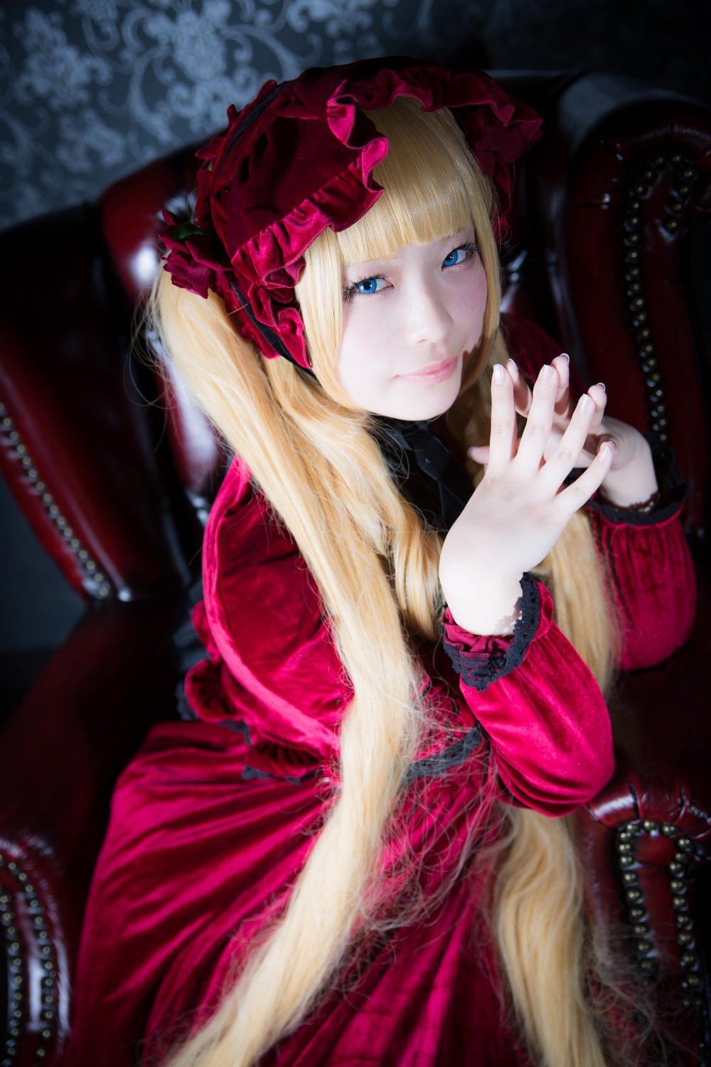 1girl bangs blonde_hair blue_eyes blurry bonnet depth_of_field dress hands_together lolita_fashion long_hair long_sleeves looking_at_viewer red_dress shinku smile solo