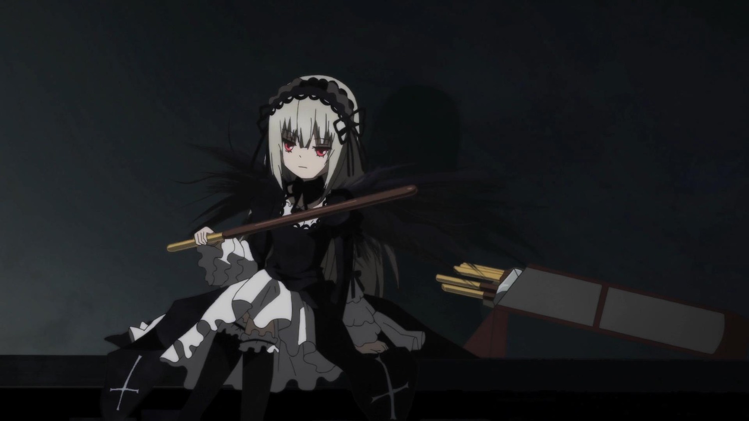 1girl black_background black_legwear closed_mouth dress frills gothic_lolita gun hairband holding holding_gun holding_weapon image lolita_fashion long_hair long_sleeves looking_at_viewer red_eyes rifle sitting solo suigintou weapon