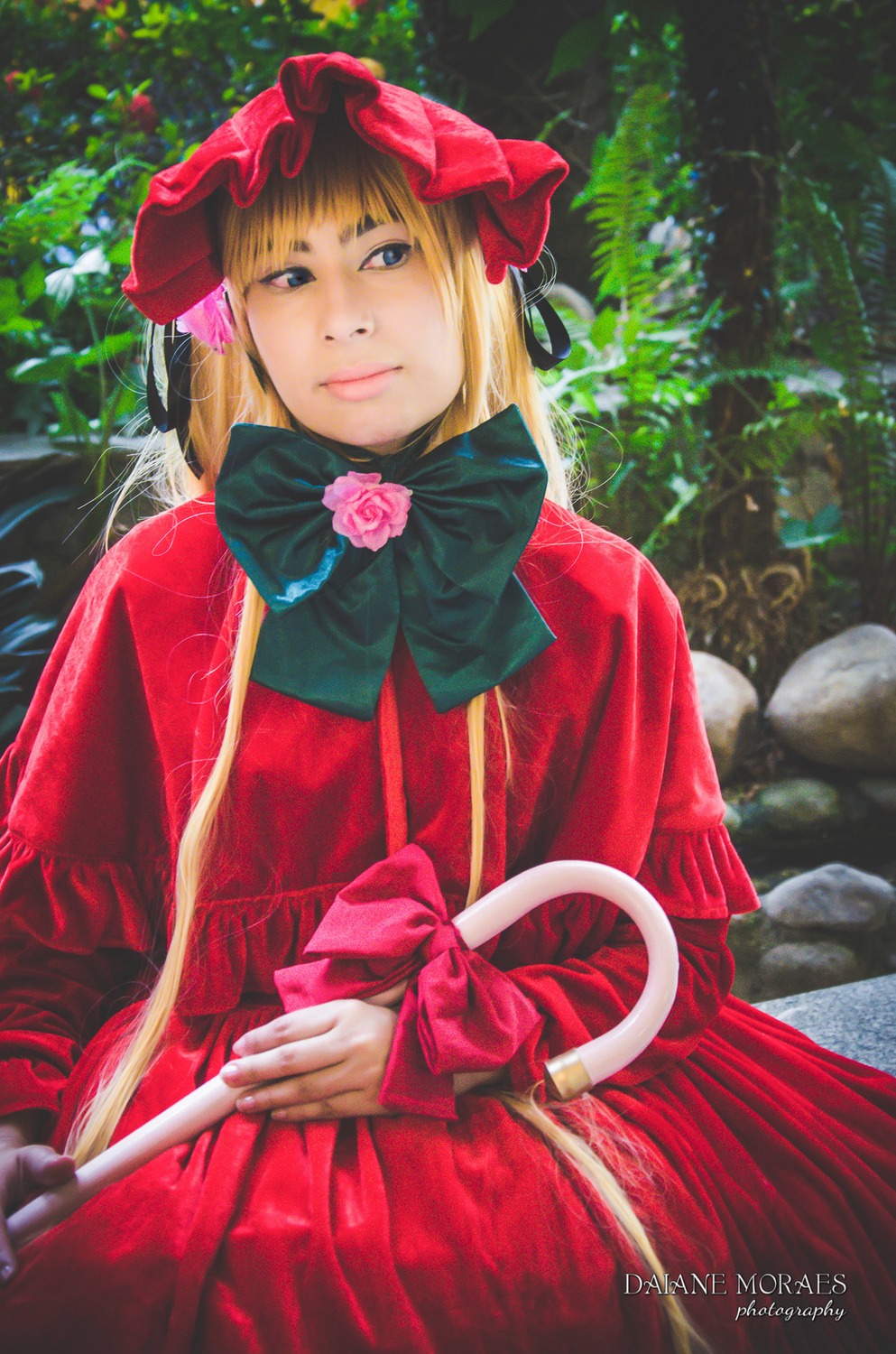 1girl artist_name blonde_hair blue_eyes bonnet bow capelet dress flower long_hair long_sleeves looking_at_viewer pink_rose red_dress ribbon rose shinku solo traditional_media