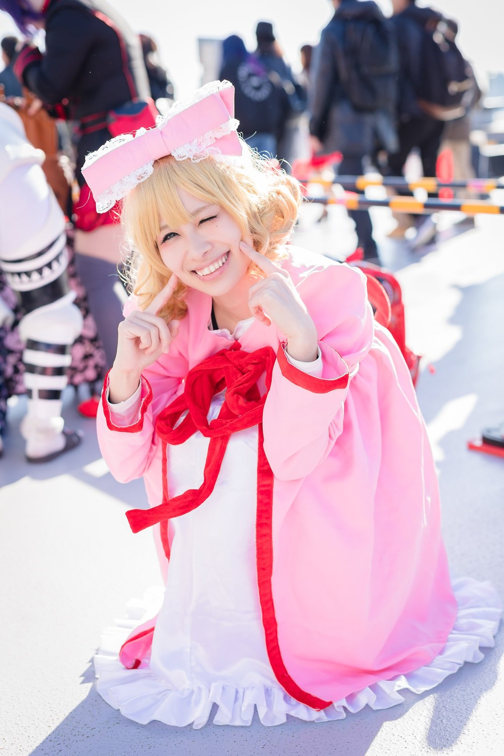 blonde_hair blurry blurry_background blurry_foreground bow closed_eyes depth_of_field dress frills grin hat hinaichigo long_hair motion_blur photo ribbon smile solo teeth wings