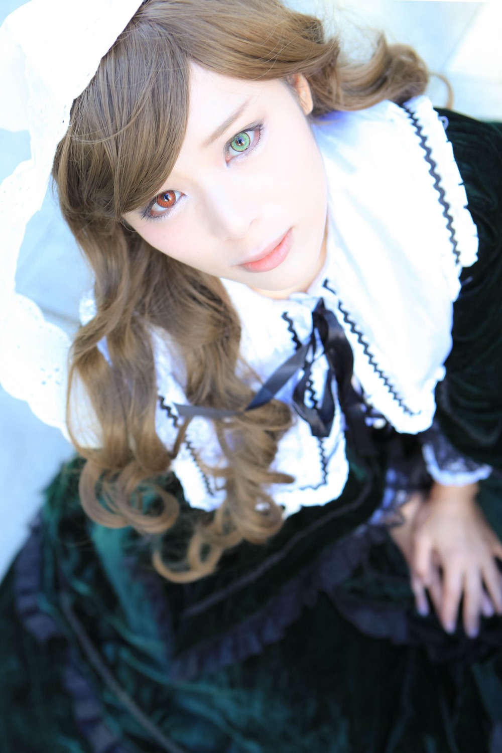 1girl blurry blurry_foreground brown_hair depth_of_field dress eyelashes frills jewelry lips lipstick lolita_fashion long_hair looking_at_viewer makeup smile solo suiseiseki