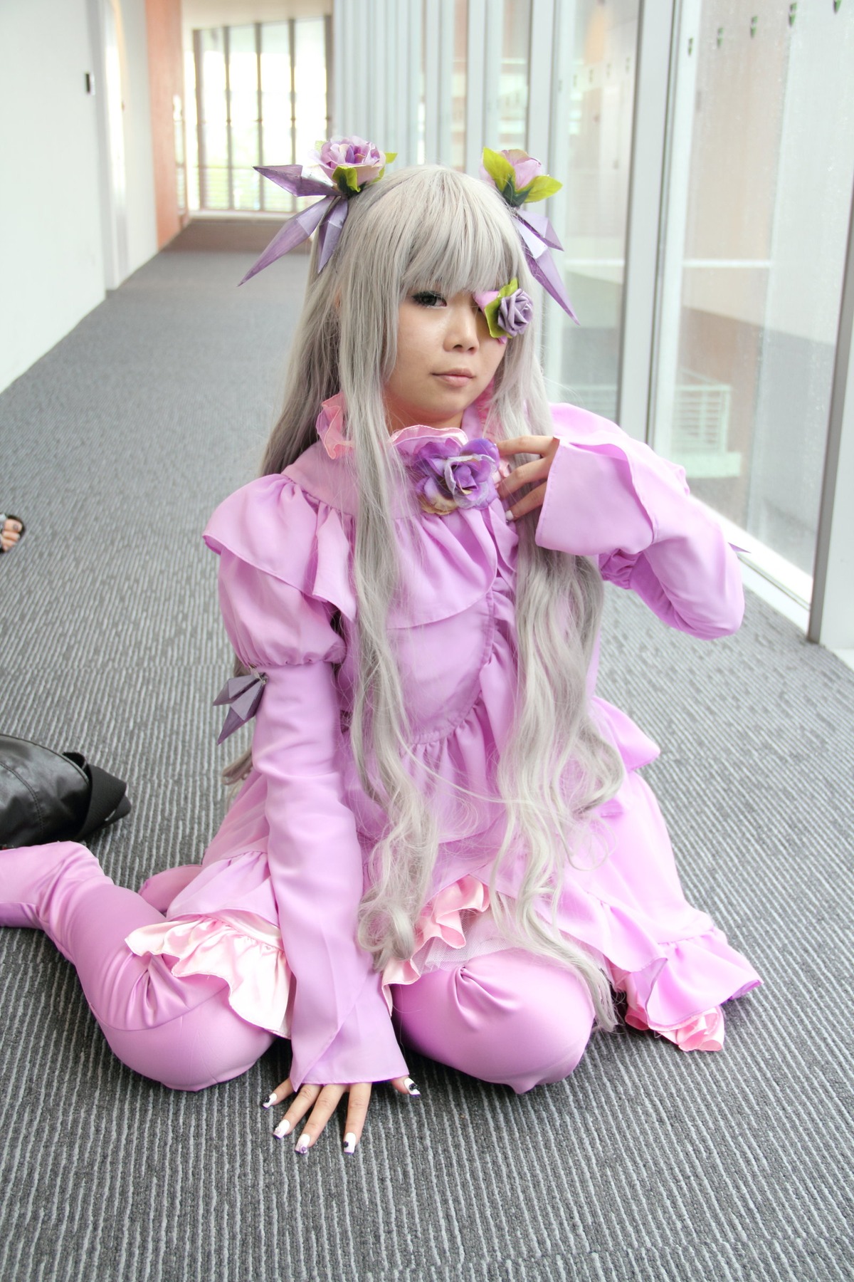 1girl barasuishou eyepatch hair_ornament indoors long_hair long_sleeves nail_polish pajamas sitting solo striped