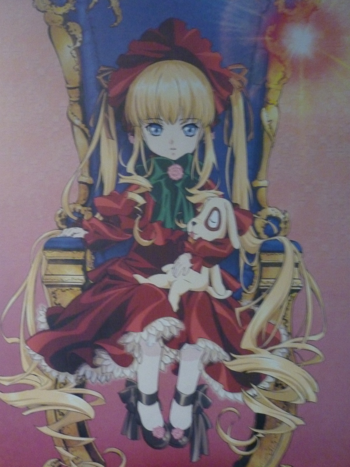 1girl blonde_hair blue_eyes bonnet bow bowtie dress drill_hair flower frills full_body green_bow image long_hair long_sleeves looking_at_viewer red_dress ringlets rose shinku shoes sitting solo twin_drills twintails very_long_hair