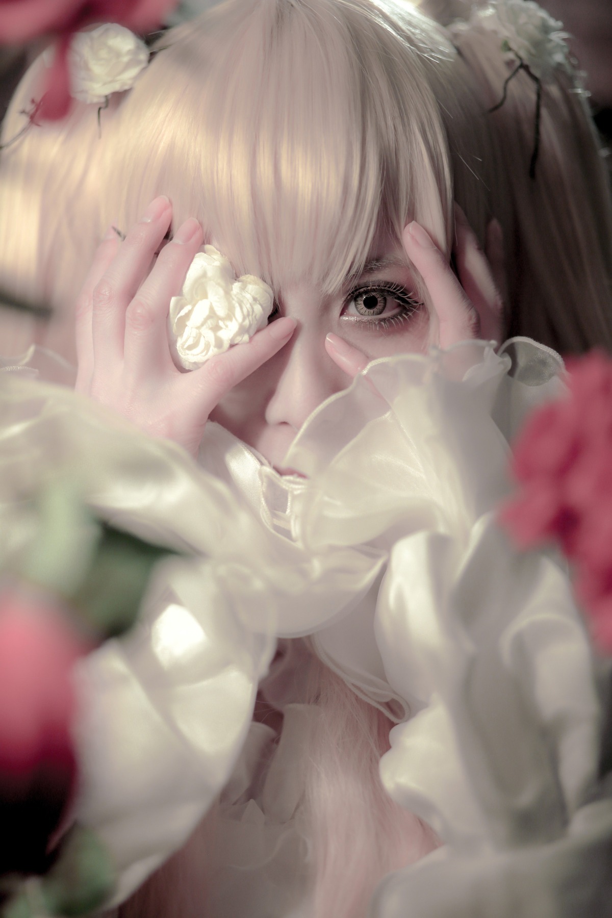 1girl bandages blonde_hair blurry blurry_foreground crying crying_with_eyes_open depth_of_field flower gloves kirakishou long_hair solo tears white_flower white_gloves