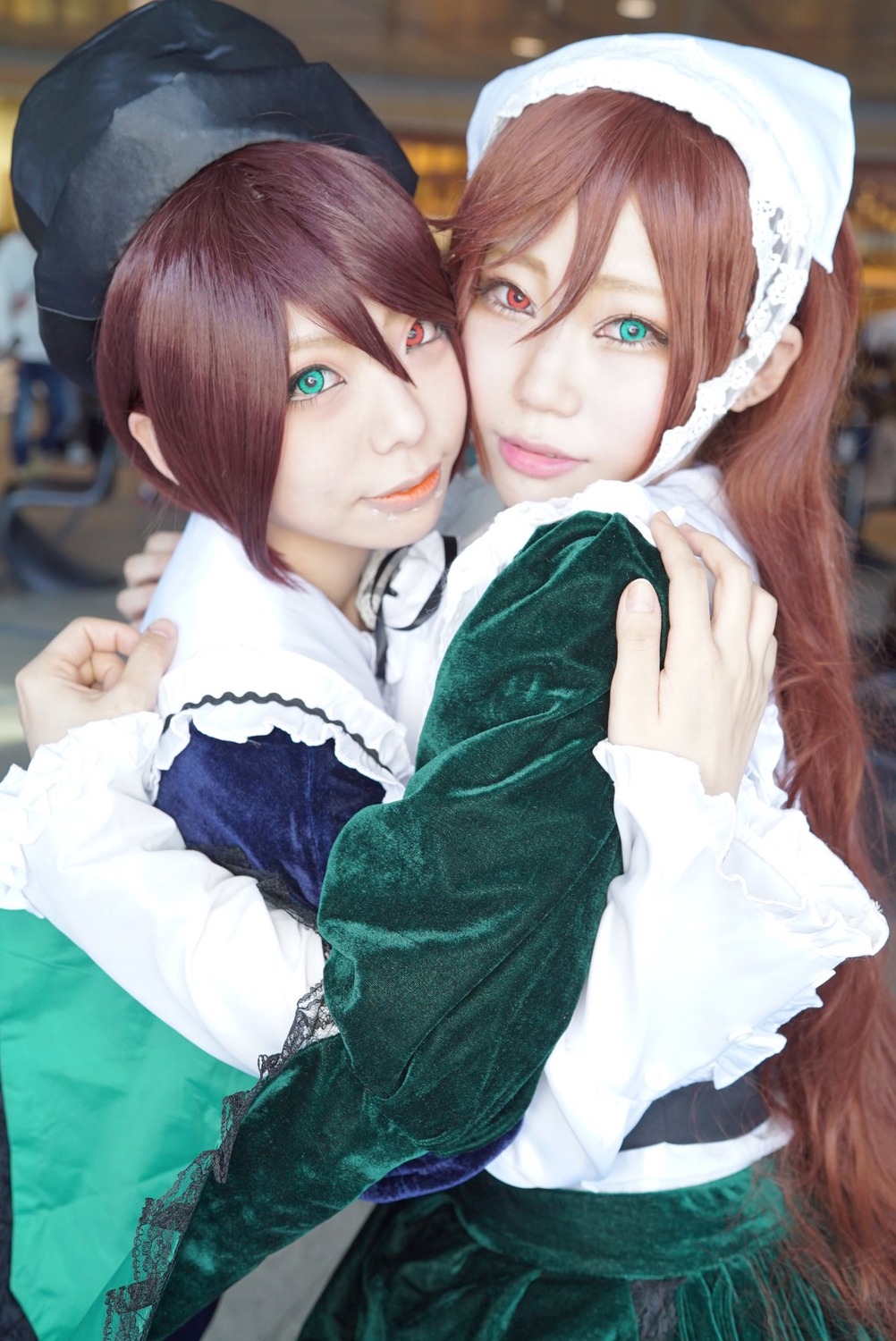 2girls blue_eyes blurry brown_hair depth_of_field dress frills green_dress green_eyes hair_between_eyes hat head_scarf heterochromia hug lips long_hair long_sleeves looking_at_viewer multiple_cosplay multiple_girls photo red_eyes short_hair siblings sisters smile souseiseki suiseiseki tagme twins