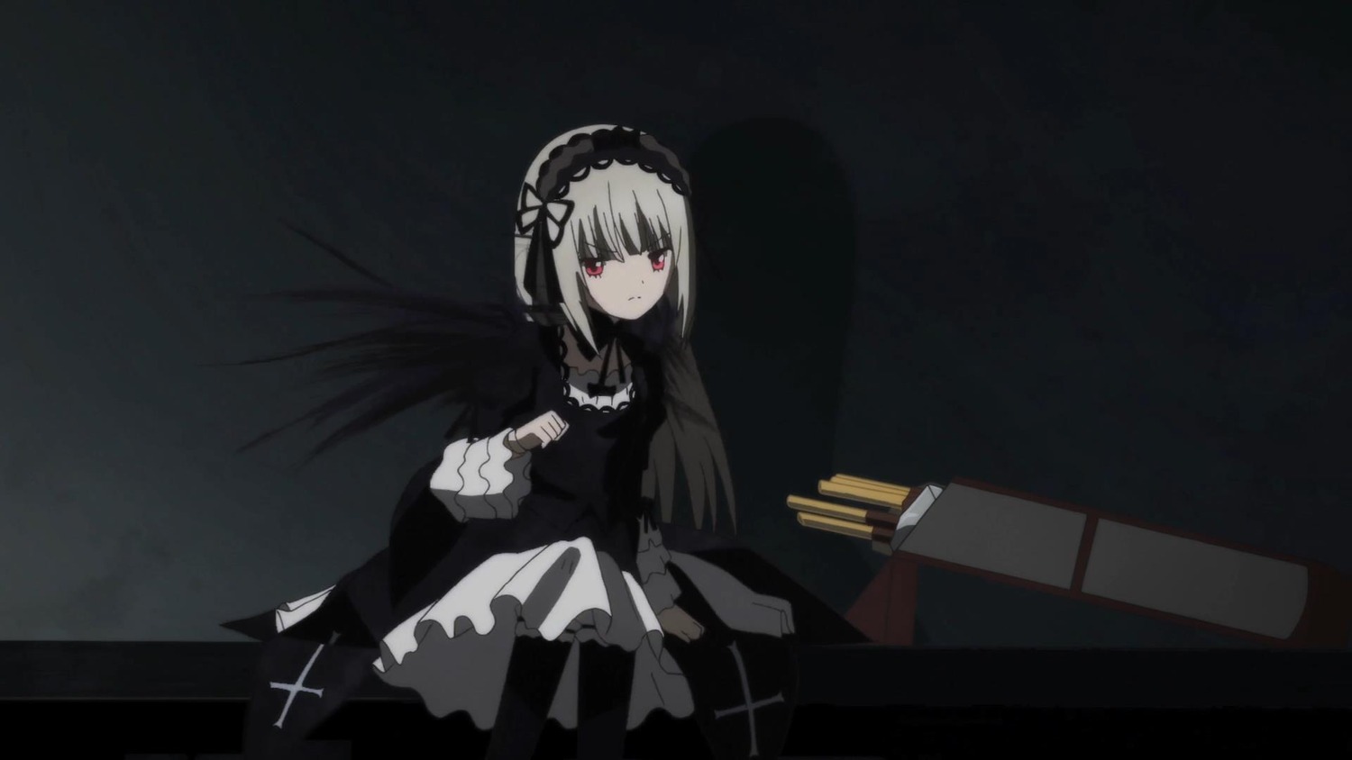 1girl black_dress chair closed_mouth dress frills hairband image long_sleeves looking_at_viewer red_eyes ribbon sitting solo suigintou wings
