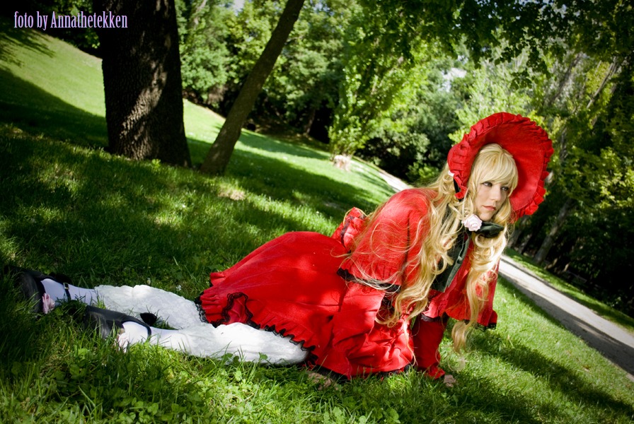 1girl blonde_hair bonnet dress grass long_hair outdoors shinku sitting solo tree umbrella