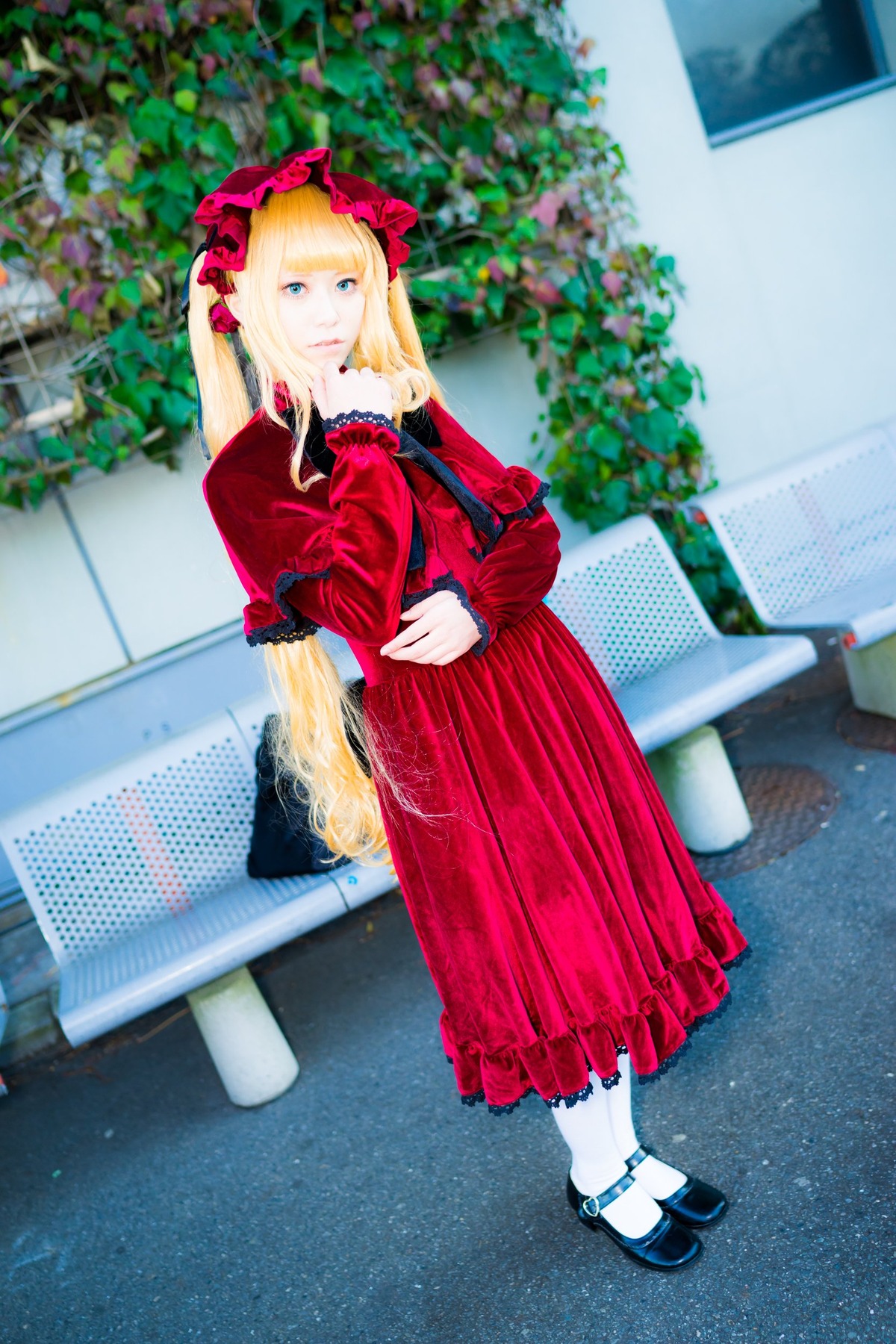 1girl bangs black_footwear blonde_hair blue_eyes blurry blurry_background depth_of_field dress flower frills full_body long_hair looking_at_viewer mary_janes outdoors photo red_dress shinku shoes solo standing white_legwear