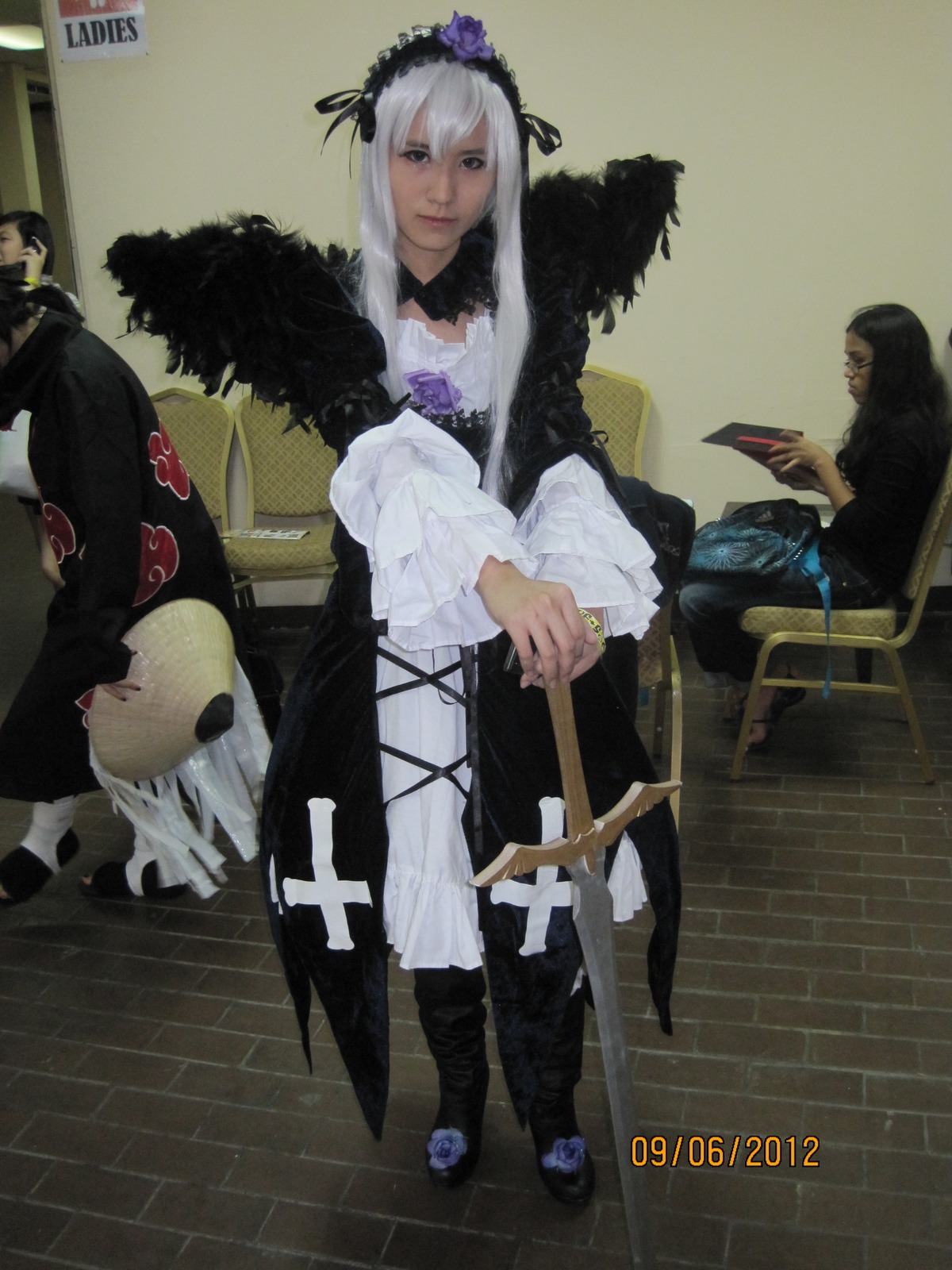 1girl bird boots crow dress feathers flower frills hairband long_hair long_sleeves silver_hair solo standing suigintou