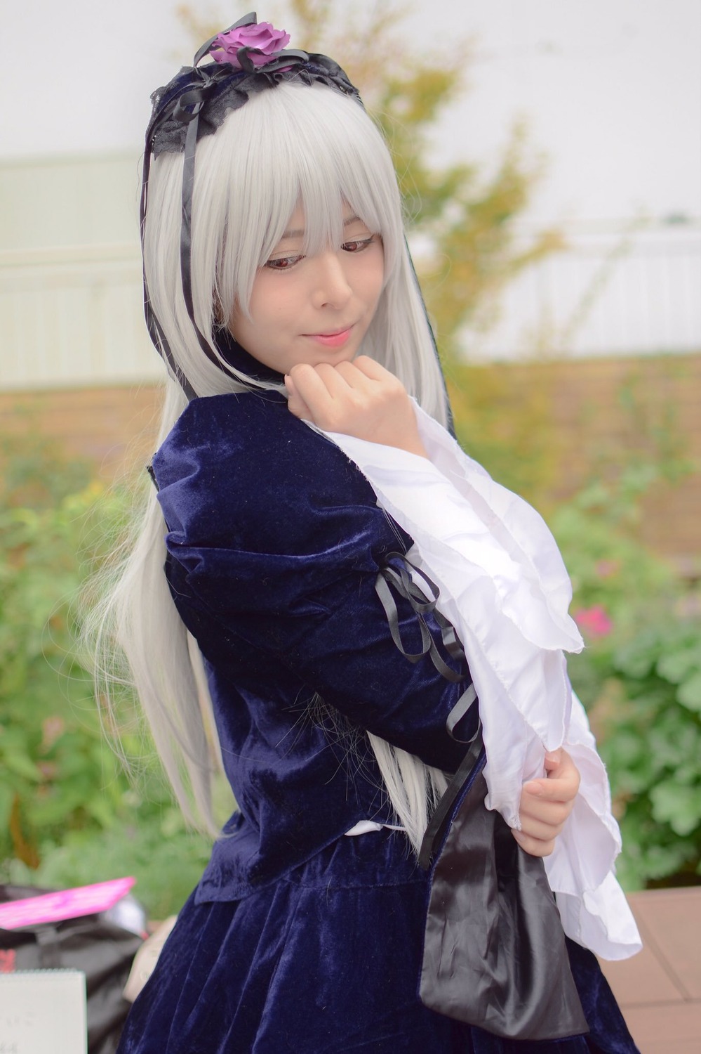 1girl blurry blurry_background depth_of_field dress hairband long_hair long_sleeves looking_at_viewer solo suigintou white_hair