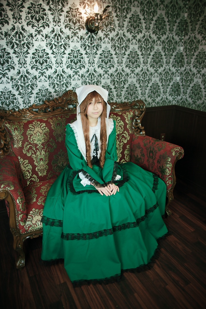 1girl brown_hair closed_eyes dress green_dress hands_on_lap long_hair own_hands_together sitting solo suiseiseki