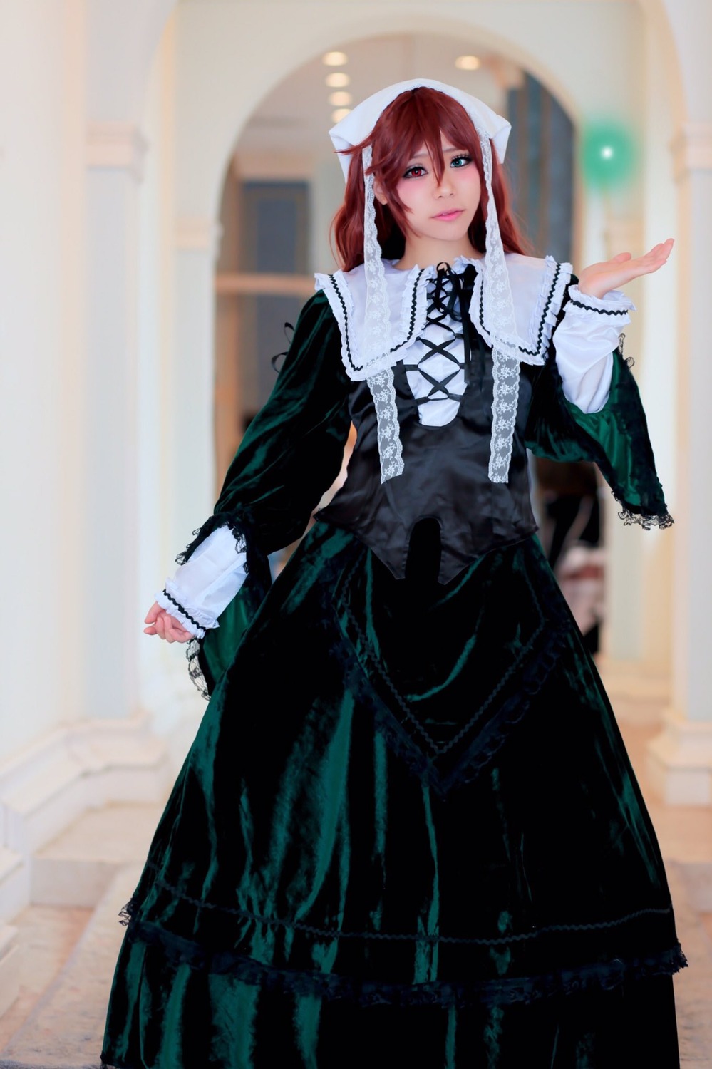 1girl 3d black_dress blurry blurry_background brown_hair corset depth_of_field dress frills long_hair long_sleeves looking_at_viewer photo red_eyes red_hair solo standing suiseiseki