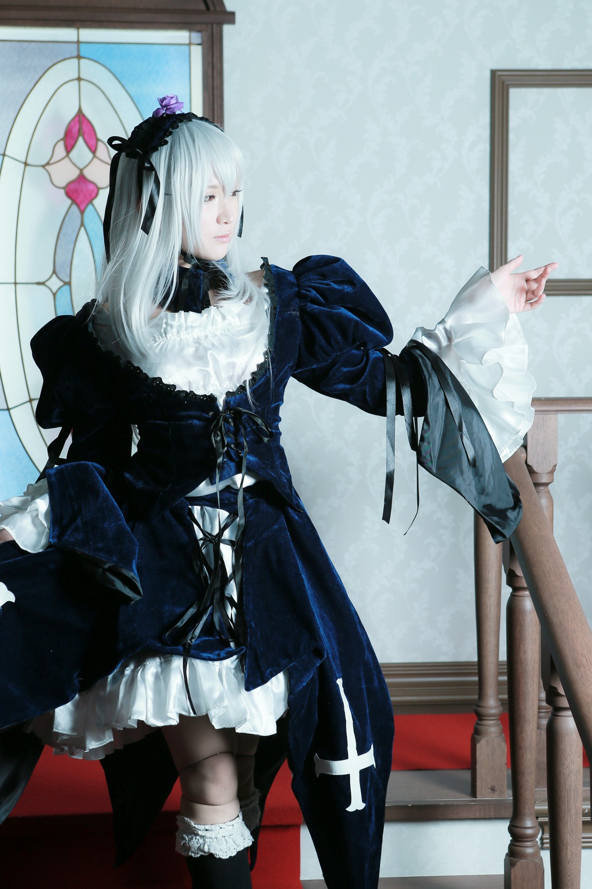 1girl black_dress boots closed_eyes dress flower frills gothic_lolita hair_ornament hairband indoors lolita_fashion long_hair long_sleeves silver_hair solo standing suigintou