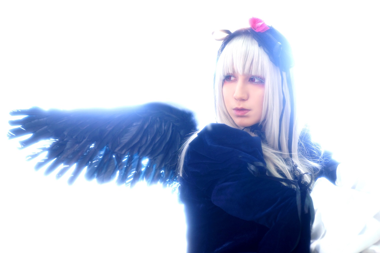 1girl bangs blue_eyes blurry closed_mouth depth_of_field feathered_wings feathers lips long_hair looking_at_viewer nose solo striped suigintou upper_body wings