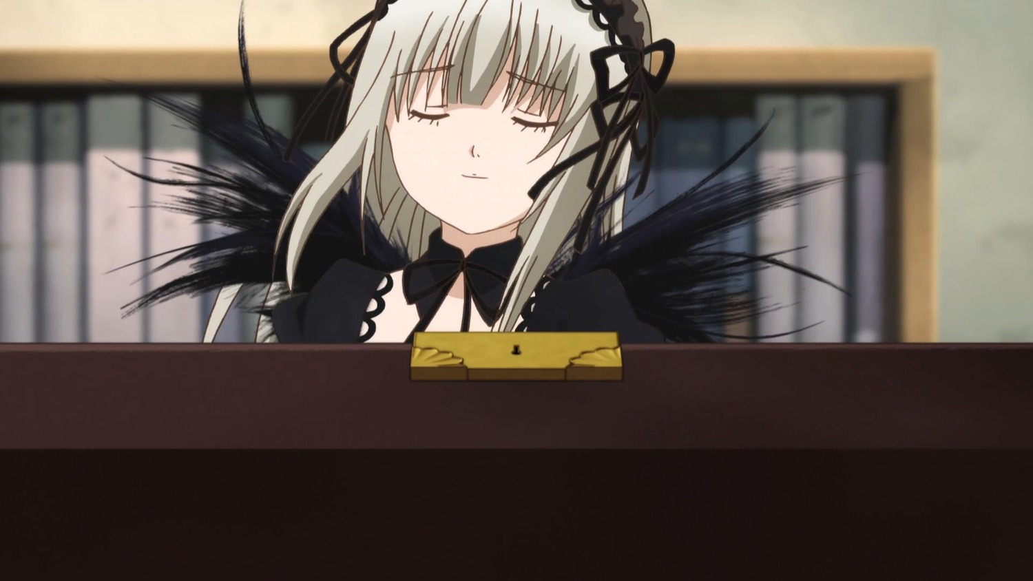1girl black_dress black_ribbon black_wings blurry closed_eyes closed_mouth depth_of_field detached_collar dress hairband image long_hair long_sleeves photo ribbon silver_hair solo suigintou table upper_body wings