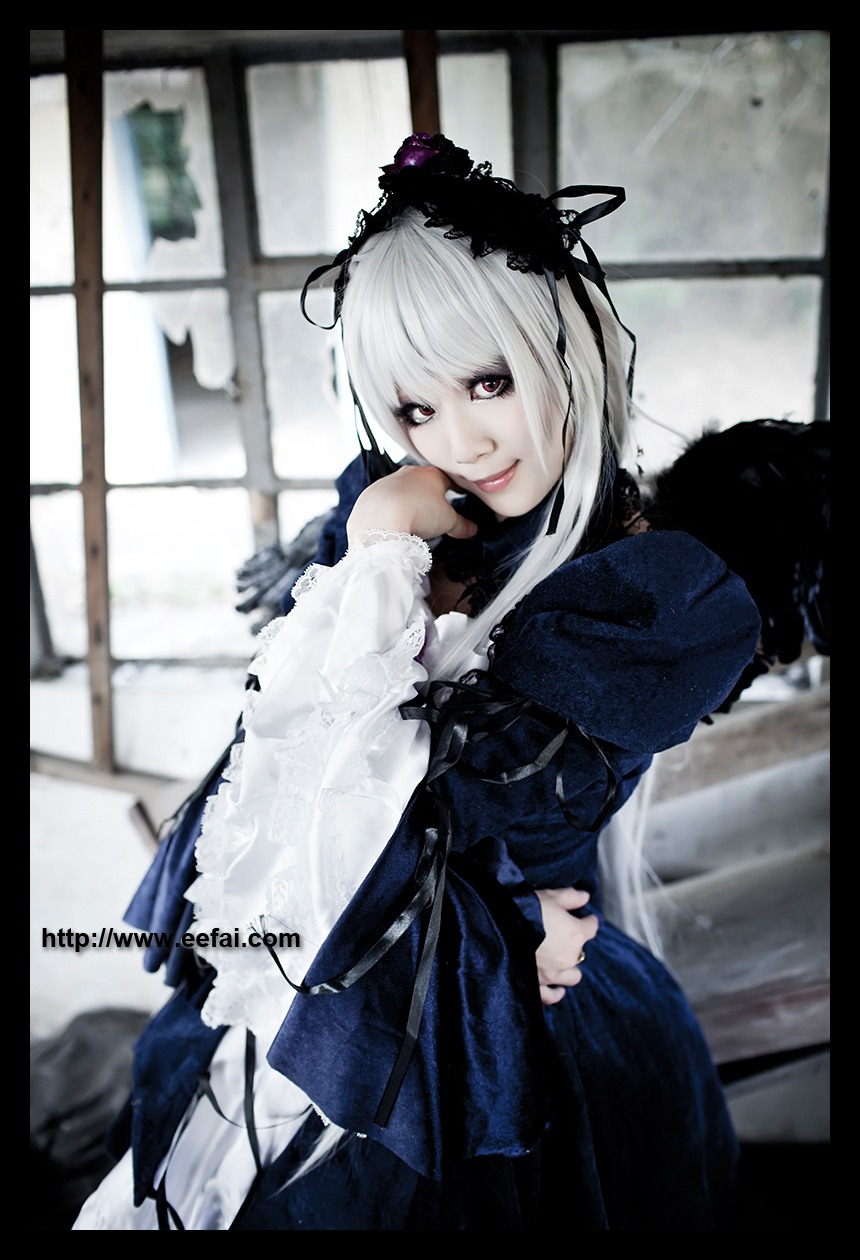 1girl black_border blurry depth_of_field dress letterboxed long_sleeves looking_at_viewer solo suigintou white_hair