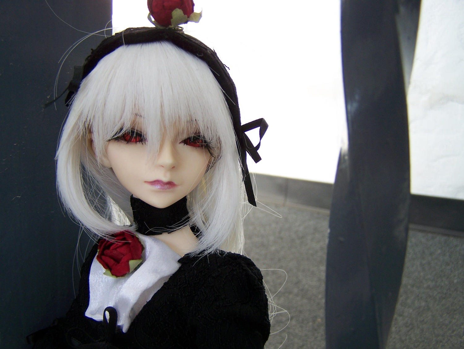 1girl apple bangs black_dress closed_mouth doll dress flower fruit hairband lips long_hair photo red_eyes red_flower red_rose rose solo suigintou white_hair