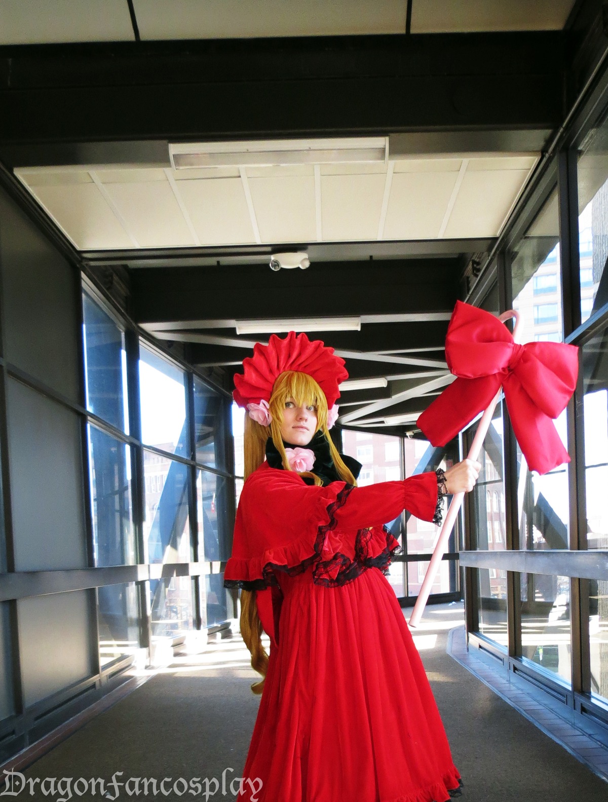 1girl blonde_hair bonnet dress flower long_hair long_sleeves red_dress rose shinku solo standing window yellow_eyes