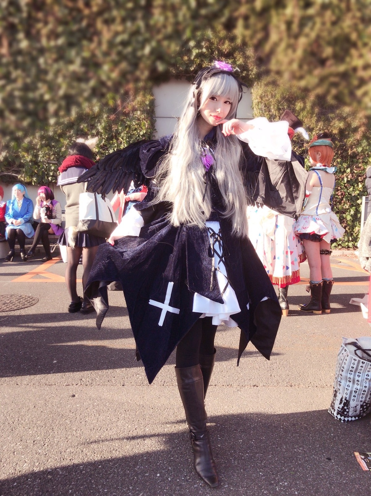 4girls bag black_footwear black_wings blurry blurry_background blurry_foreground boots casual contemporary day depth_of_field dress feathered_wings hat long_hair multiple_girls outdoors photo_background shameimaru_aya short_hair silver_hair skirt solo standing suigintou walking wings