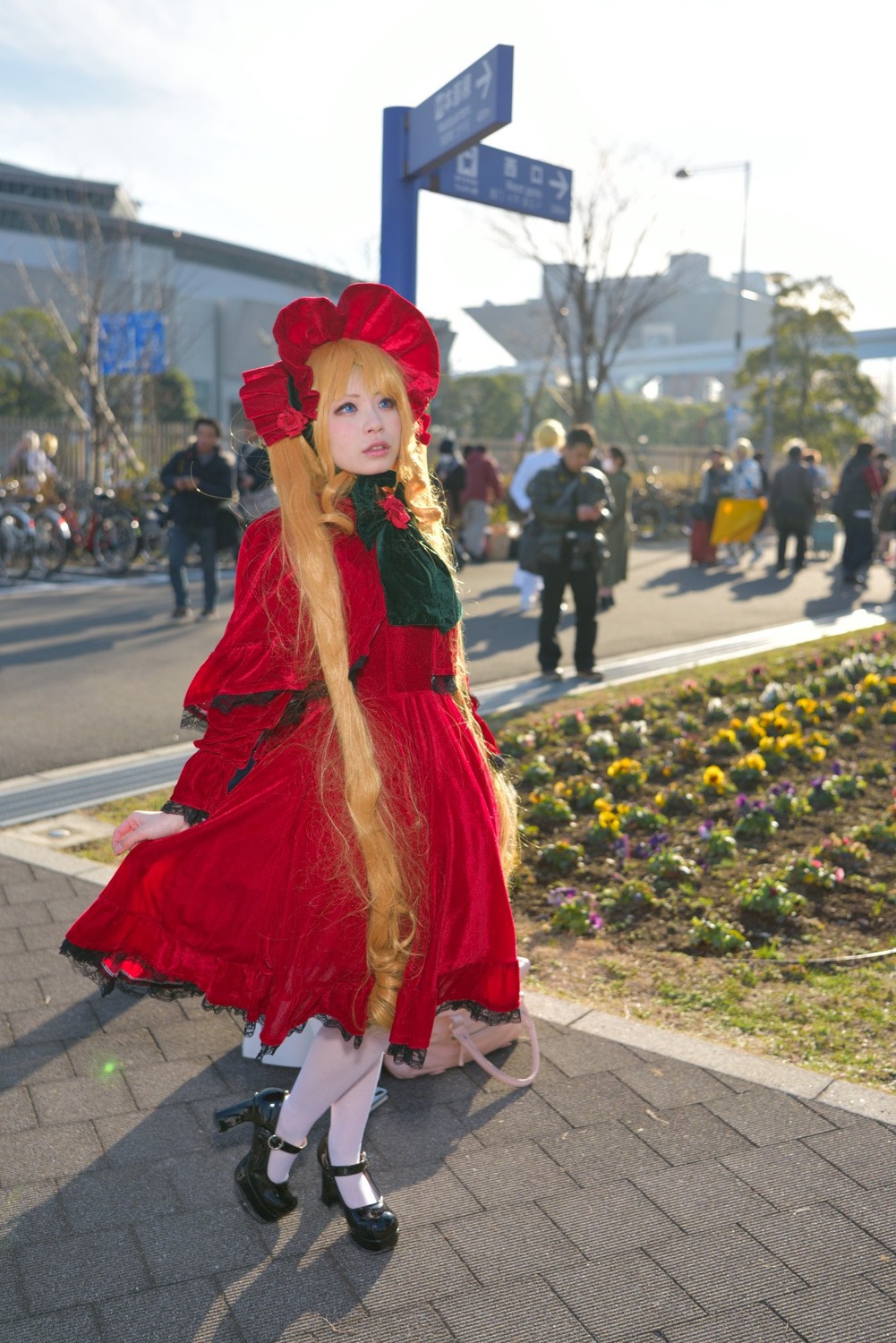 1girl black_footwear blonde_hair blue_eyes dress flower full_body hat looking_at_viewer outdoors pavement red_dress shinku shoes solo standing twin_braids