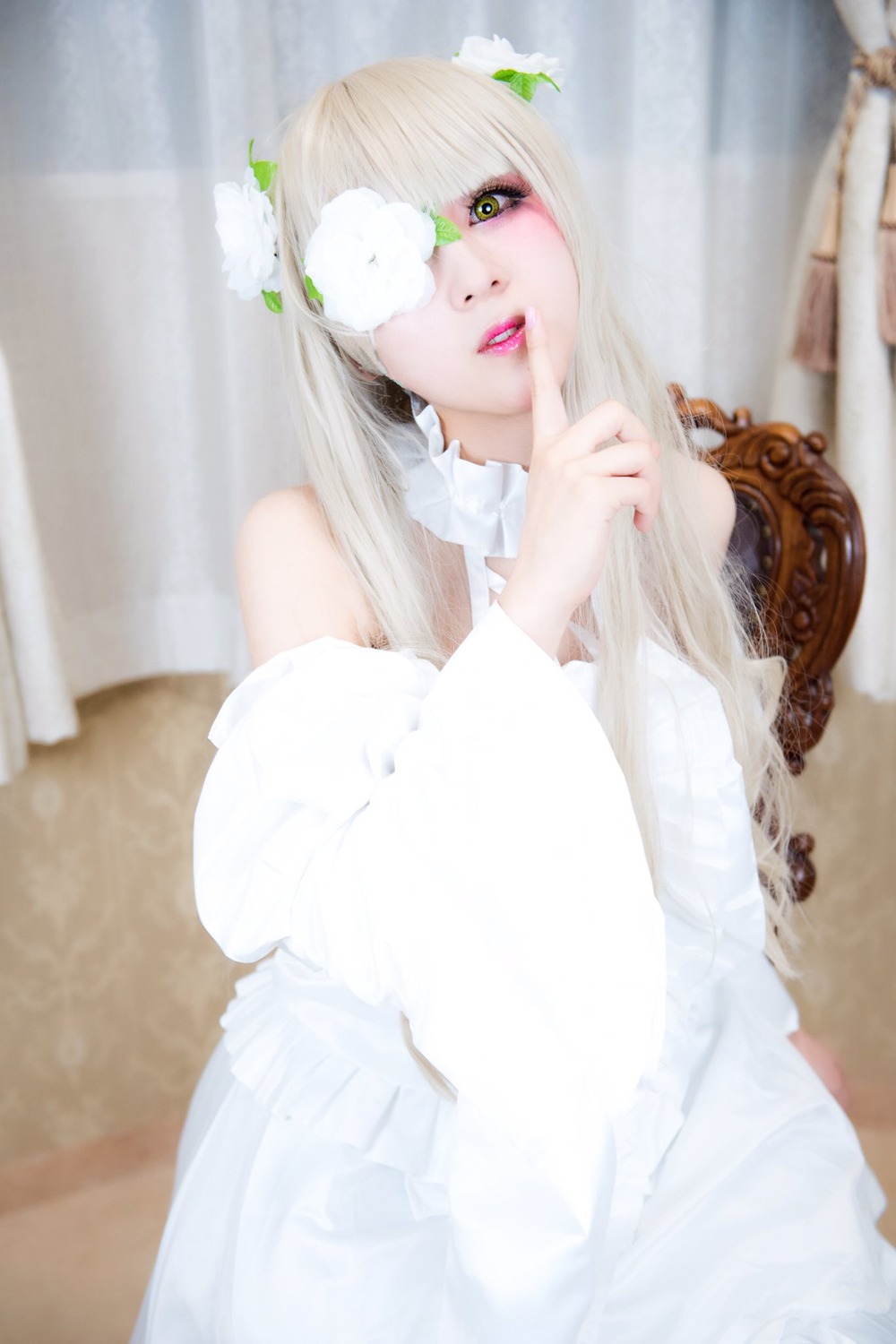 1girl blonde_hair blurry blurry_background depth_of_field flower green_eyes hair_ornament kirakishou lips long_hair parted_lips photo solo white_hair