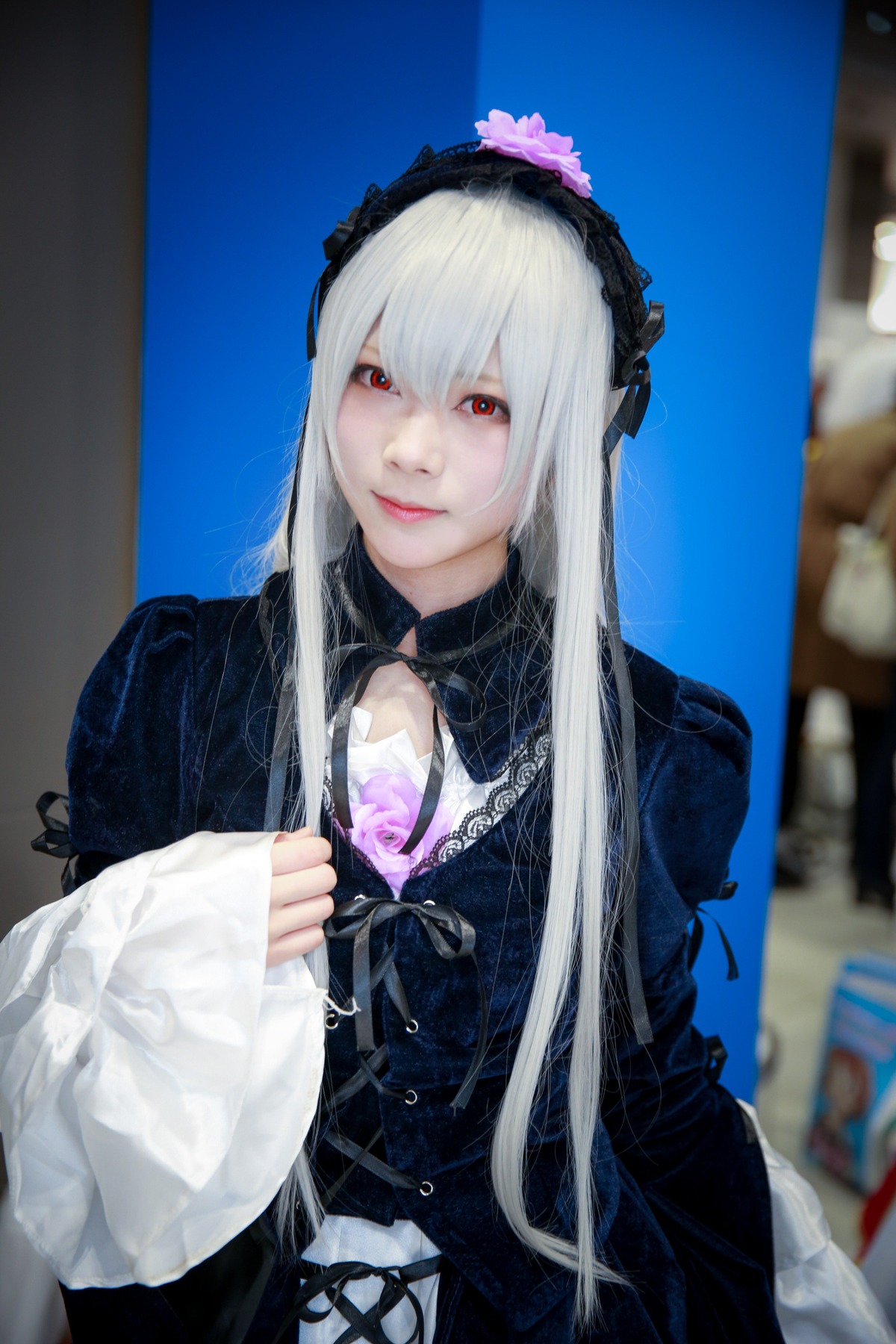 1girl 3d black_dress blurry blurry_background blurry_foreground depth_of_field dress flower frills gothic_lolita hairband lips long_hair long_sleeves looking_at_viewer photo red_eyes silver_hair sky smile solo suigintou