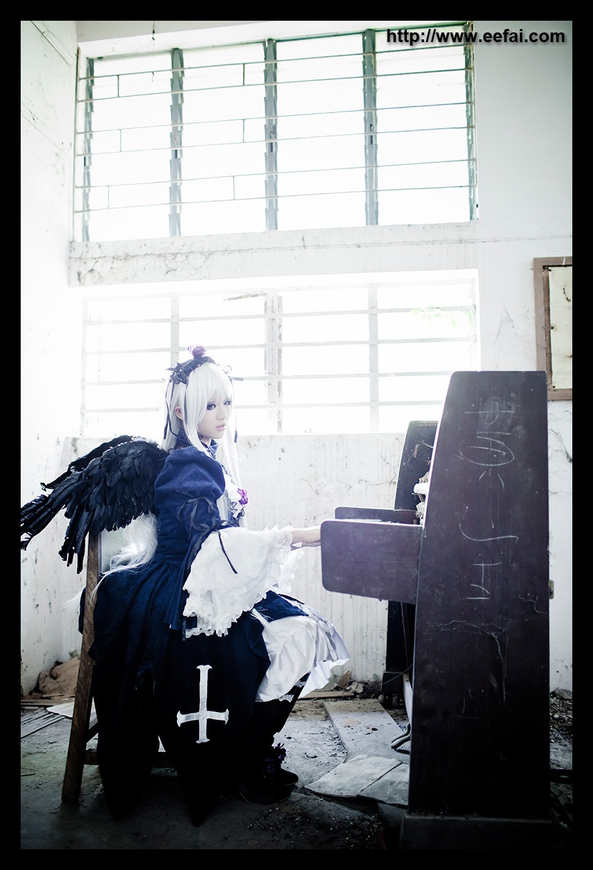 1girl black_border black_wings blue_eyes dress feathers indoors letterboxed long_hair profile sitting solo suigintou window wings