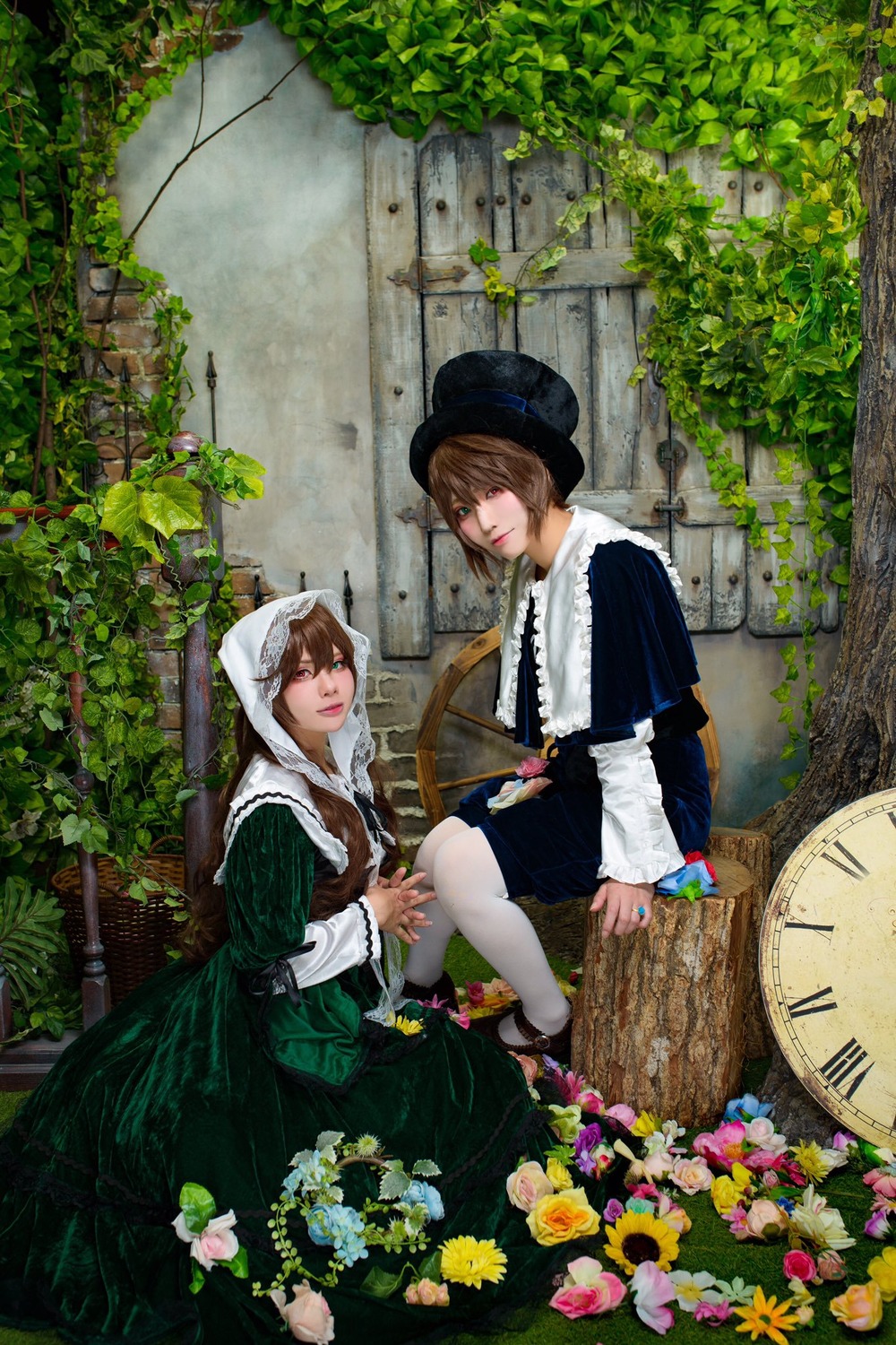 2girls blue_eyes brown_hair dress flower green_eyes hat hood lips looking_at_viewer multiple_cosplay multiple_girls outdoors plant short_hair sitting tagme white_legwear