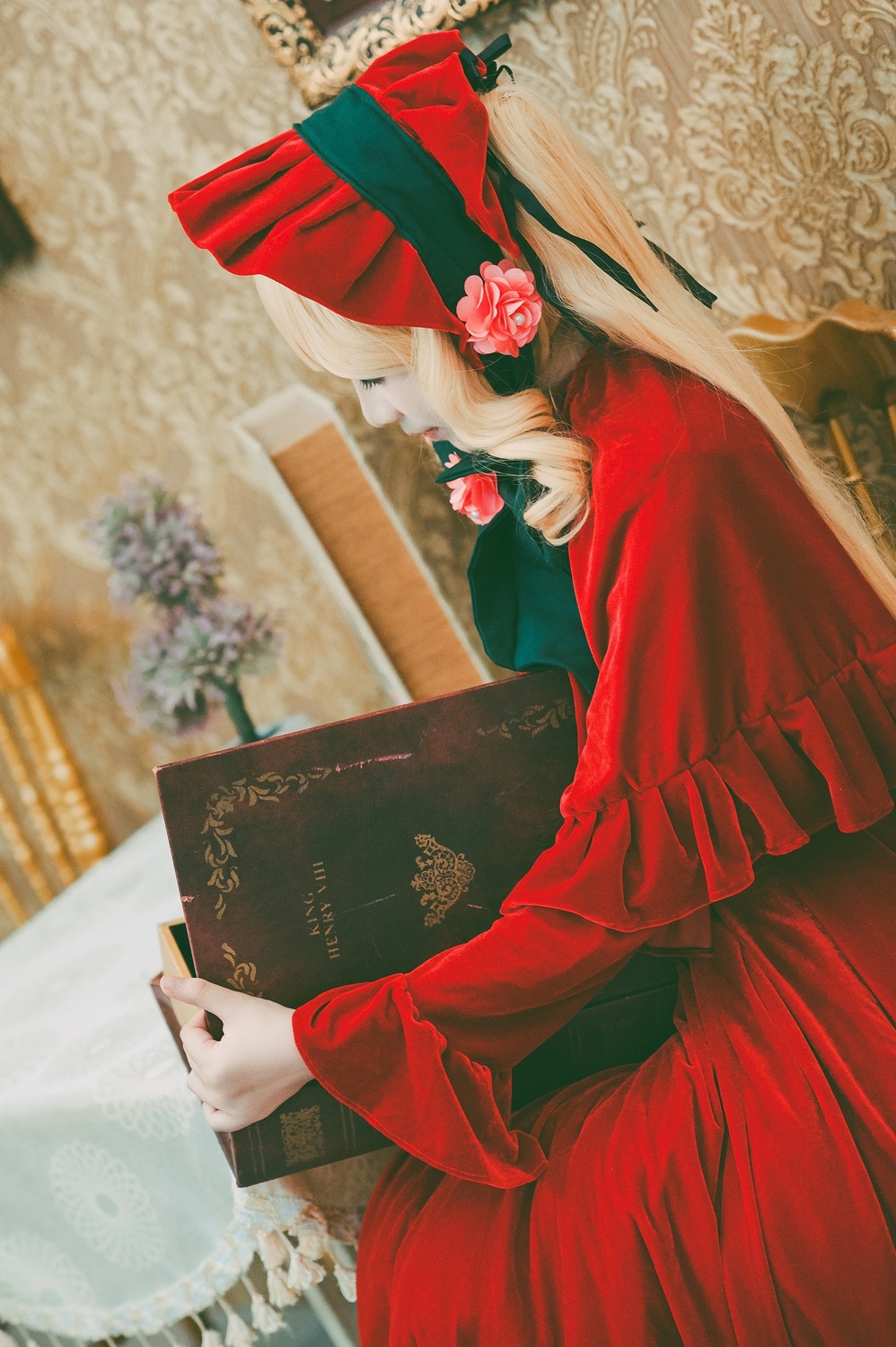 1girl book dress flower holding indoors long_hair long_sleeves nail_polish red_dress rose shinku sitting solo white_hair