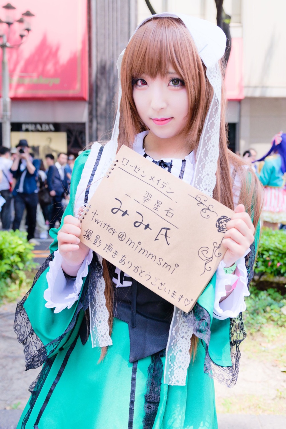 1girl bangs blurry blurry_background brown_hair depth_of_field holding lips long_hair looking_at_viewer photo realistic smile solo suiseiseki