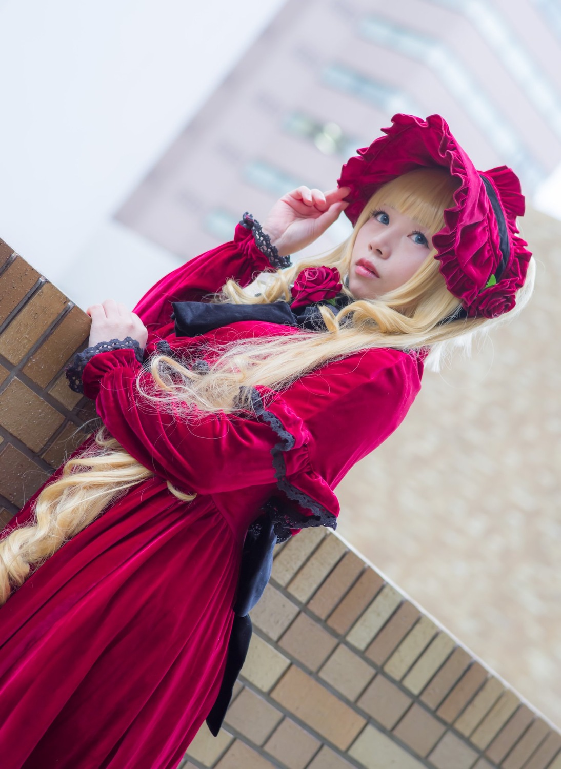 1girl bangs blonde_hair blue_eyes bonnet bow capelet dress flower lips long_hair long_sleeves looking_at_viewer pink_flower pink_rose red_capelet red_dress red_flower red_rose rose shinku solo