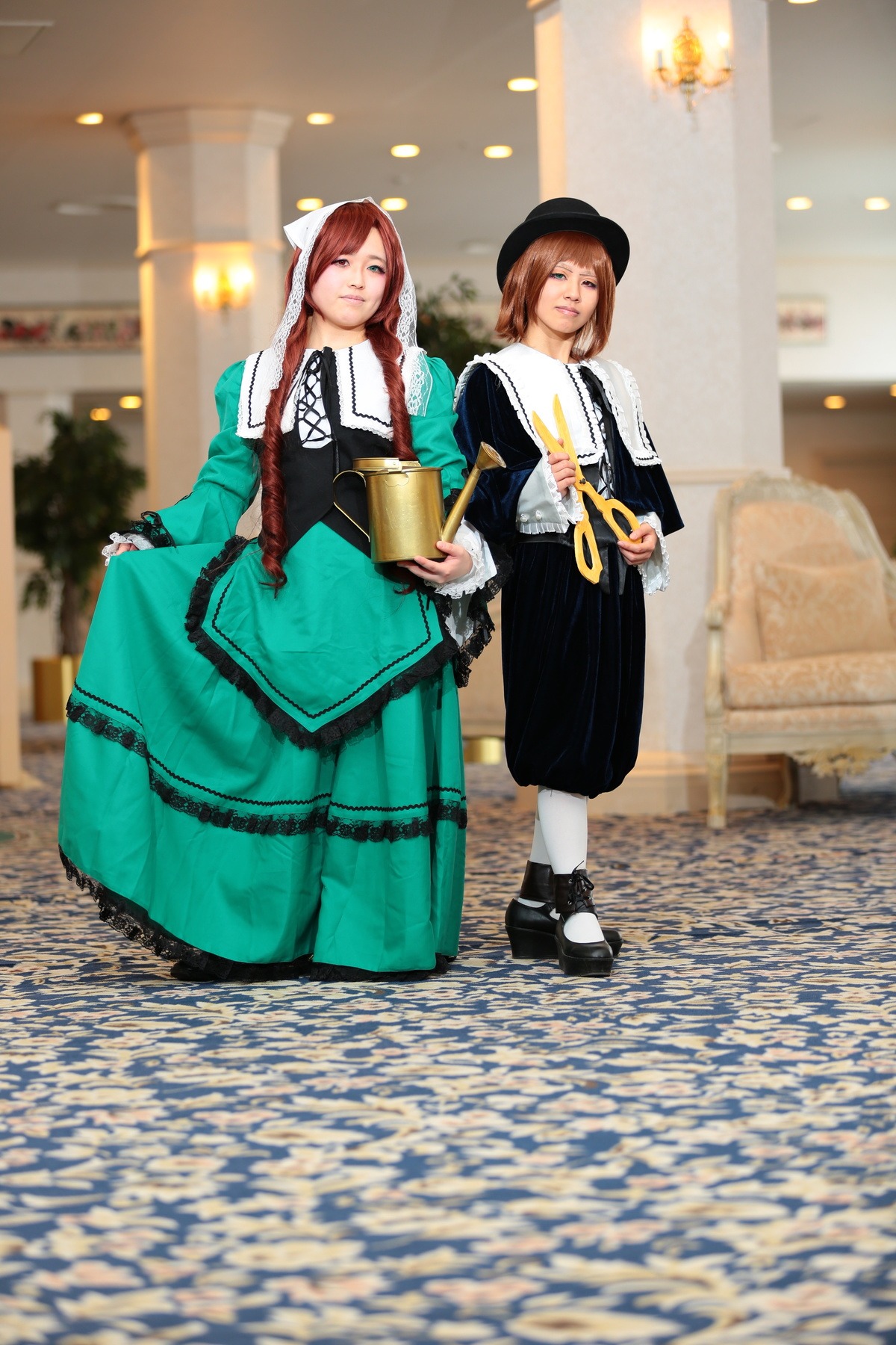 2girls black_footwear blurry braid brown_hair depth_of_field dress hat long_hair multiple_cosplay multiple_girls one_eye_closed shoes smile standing tagme white_legwear